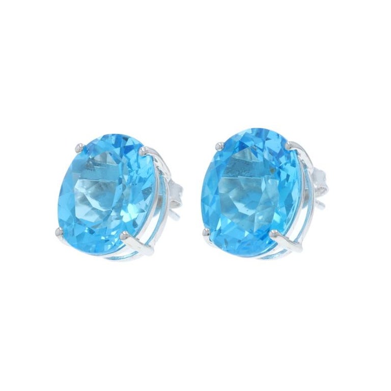 White Gold Swiss Blue Topaz Stud Earrings - 14k Oval 12.00  display picture 1