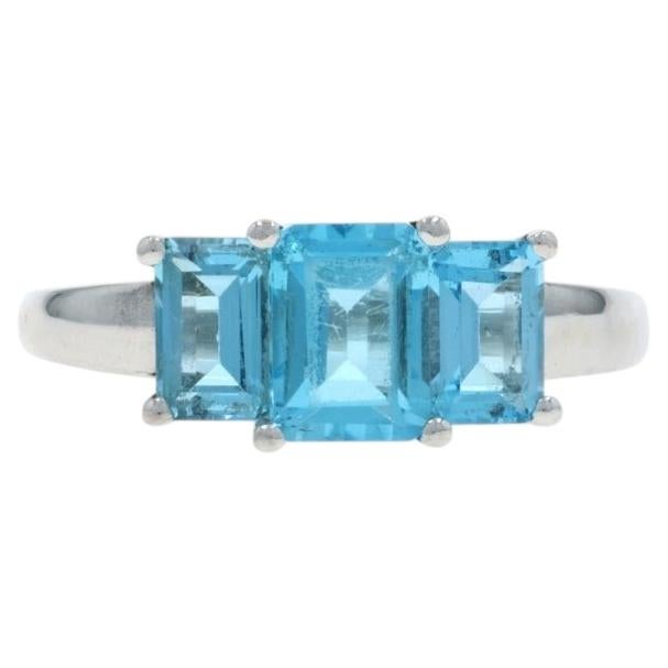 White Gold Swiss Blue Topaz Three-Stone Ring - 10k Emerald 2.48ctw