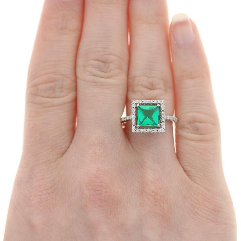 Size: 6 1/2
Sizing Fee: Up 2 sizes or Down 1 size for $35 

Metal Content: 14k White Gold 

Stone Information: 
Synthetic Emerald
Carat: 1.19ct
Cut: Square
Color: Green
Size: 7mm (square)

Natural Diamonds
Total Carats: .32ctw 
Cut: Round Brilliant