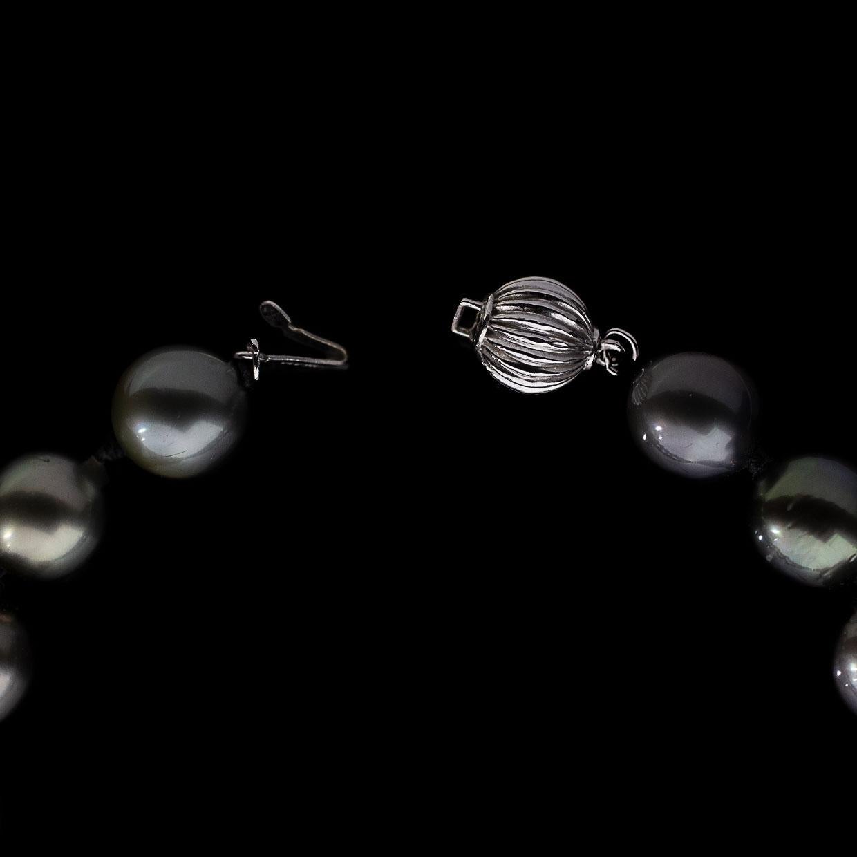Item Details 325-466
Main Stone  Pearl
Main Stone Type Tahitian
Main Stone Color Black
Estimated Retail $4,500.00
Metal White Gold
Style Strand/String
Fastening Pearl Clasp

Stone 1 Information
Stone Type Pearl
Stone Shape Tahitian
Stone Color