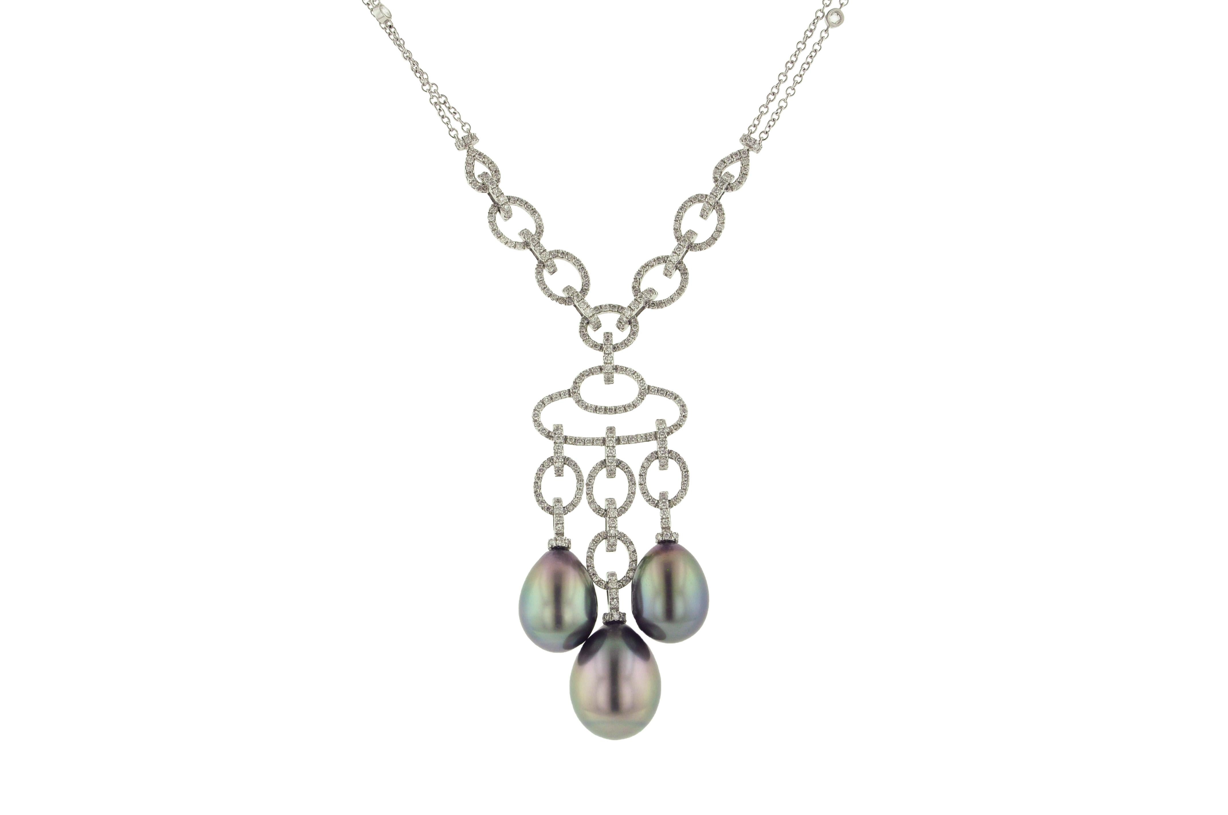 Necklace and earring set crafted in 18 karat white gold with beautiful Tahitian silver grey pearls

The necklace has three gorgeous cultured pearls and 2.55 carats of diamonds.
Length: 16 inches + Pearl Drop 2 1/2 inches

The earrings have two