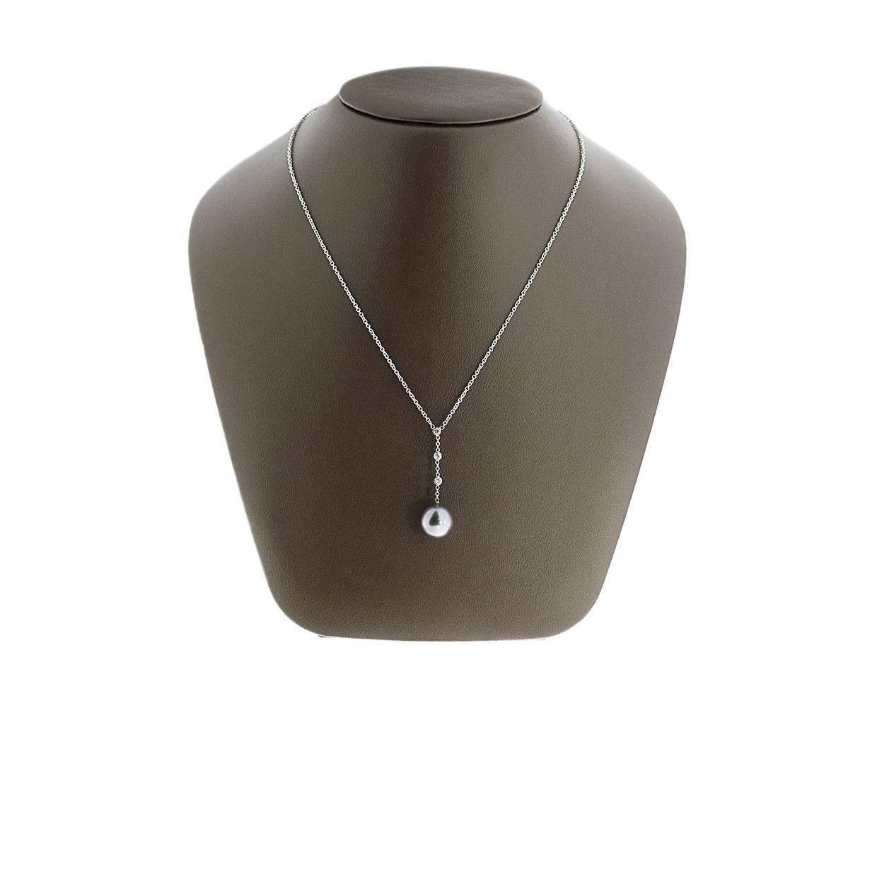 Simple yet elegant & beautiful would be the best way to describe this stunning 18K white gold Tahitian pearl and diamond pendant necklace! It features a round pearl and 3 round diamonds. The pearl and diamond pendant is attached to an 18K white