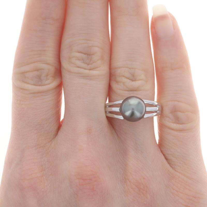 Size: 7 3/4
Sizing Fee: Up 2 sizes for $45 or Down 2 sizes for $45

Metal Content: 14k White Gold

Stone Information
Tahitian Pearl
Color: Grey
Size: 9.2mm x 9.3mm

Style: Solitaire
Features: Open Cut Shoulders

Measurements
Face Height (north to