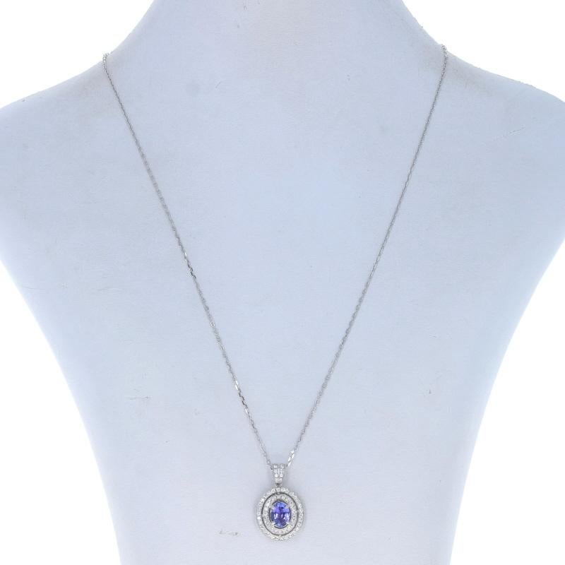 Metal Content: 14k White Gold

Stone Information
Natural Tanzanite
Treatment: Routinely Enhanced
Carat: 1.12ct
Cut: Oval
Color: Purple

Natural Diamonds
Carats: .50ctw
Cut: Round Brilliant
Color: G - H
Clarity: SI1 - SI2

Total Carats: