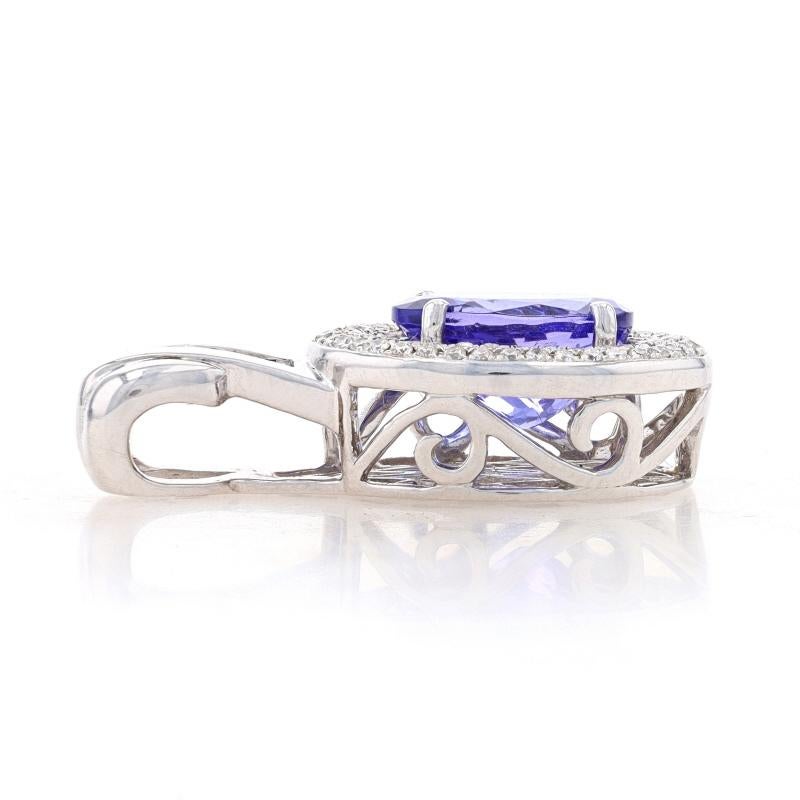 Metal Content: 14k White Gold

Stone Information
Natural Tanzanite
Treatment: Routinely Enhanced
Carat(s): 3.85ct
Cut: Oval
Color: Purple

Natural Diamonds
Carat(s): .68ctw
Cut: Round Brilliant
Color: H - I
Clarity: SI1 - SI2

Total Carats: