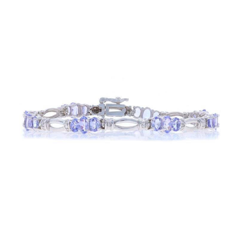 Metal Content: 14k White Gold

Stone Information

Natural Tanzanite
Treatment: Routinely Enhanced
Carat(s): 3.52ctw
Cut: Oval
Color: Bluish Purple

Natural Diamonds
Carat(s): 0.08ctw
Cut: Round Brilliant
Color: G - H
Clarity: SI2 - I1

Total Carats: