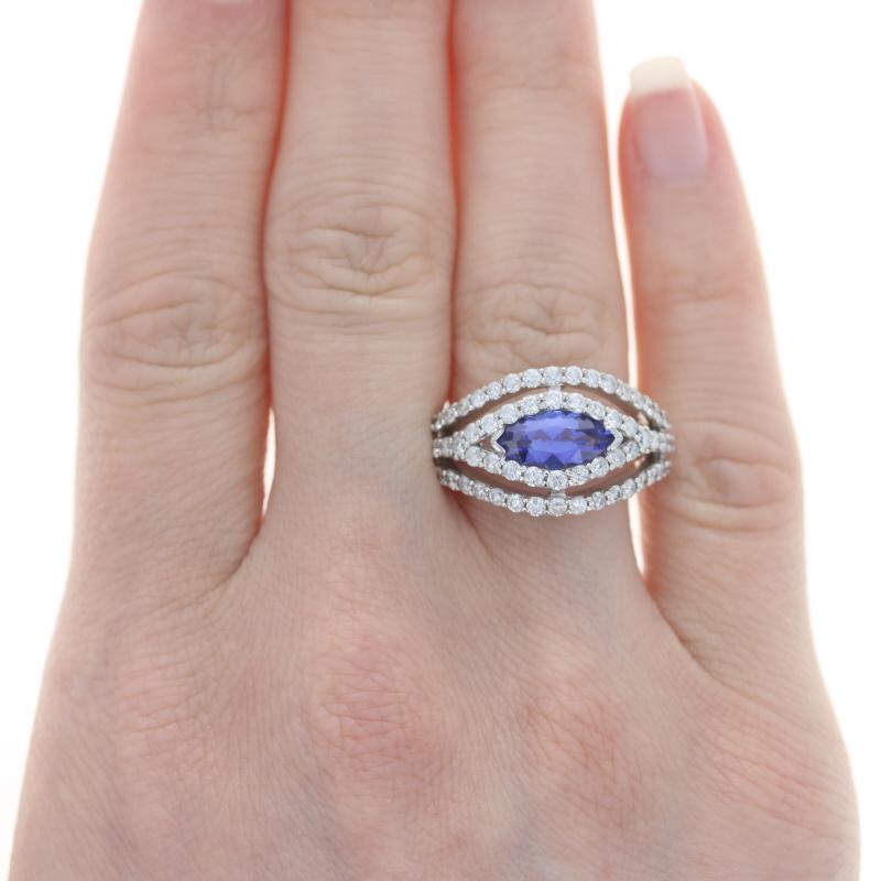 Size: 8

Metal Content: 14k White Gold

Stone Information

Natural Tanzanite
Treatment: Routinely Enhanced
Carat(s): 1.40ct
Cut: Marquise
Color: Purple
Stone Note: (weighed)

Natural Diamonds
Carat(s): 1.50ctw
Cut: Round Brilliant
Color: G -