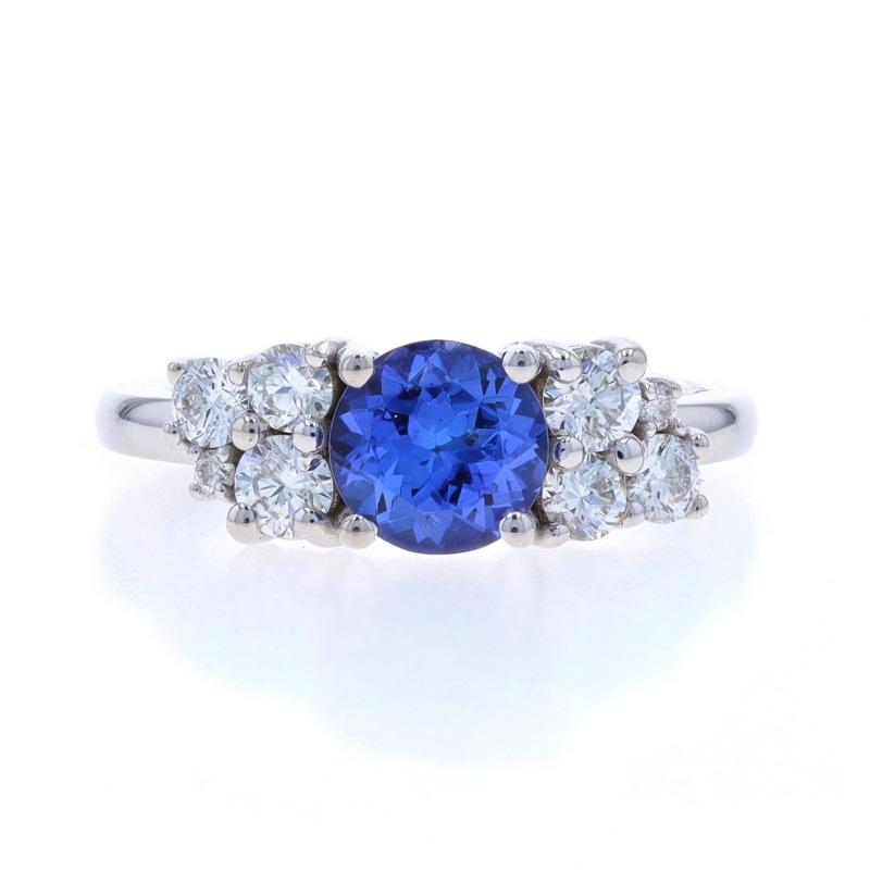 Size: 4
Sizing Fee: Up 2 sizes for $50 or Down 1 size for $30

Metal Content: 18k White Gold

Stone Information

Natural Tanzanite
Treatment: Routinely Enhanced
Carat(s): .86ct
Cut: Round
Color: Purple

Natural Diamonds
Carat(s): .40ctw
Cut: Round