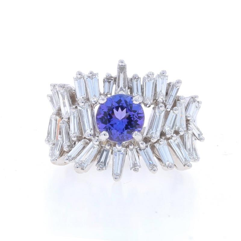 Size: 7
Sizing Fee: Up 1 1/2 sizes for $60 or Down 1 size for $40

Metal Content: 18k White Gold

Stone Information

Natural Tanzanite
Treatment: Routinely Enhanced
Carat(s): 1.53ct
Cut: Round
Color: Purple

Natural Diamonds
Carat(s): 2.08ctw
Cut: