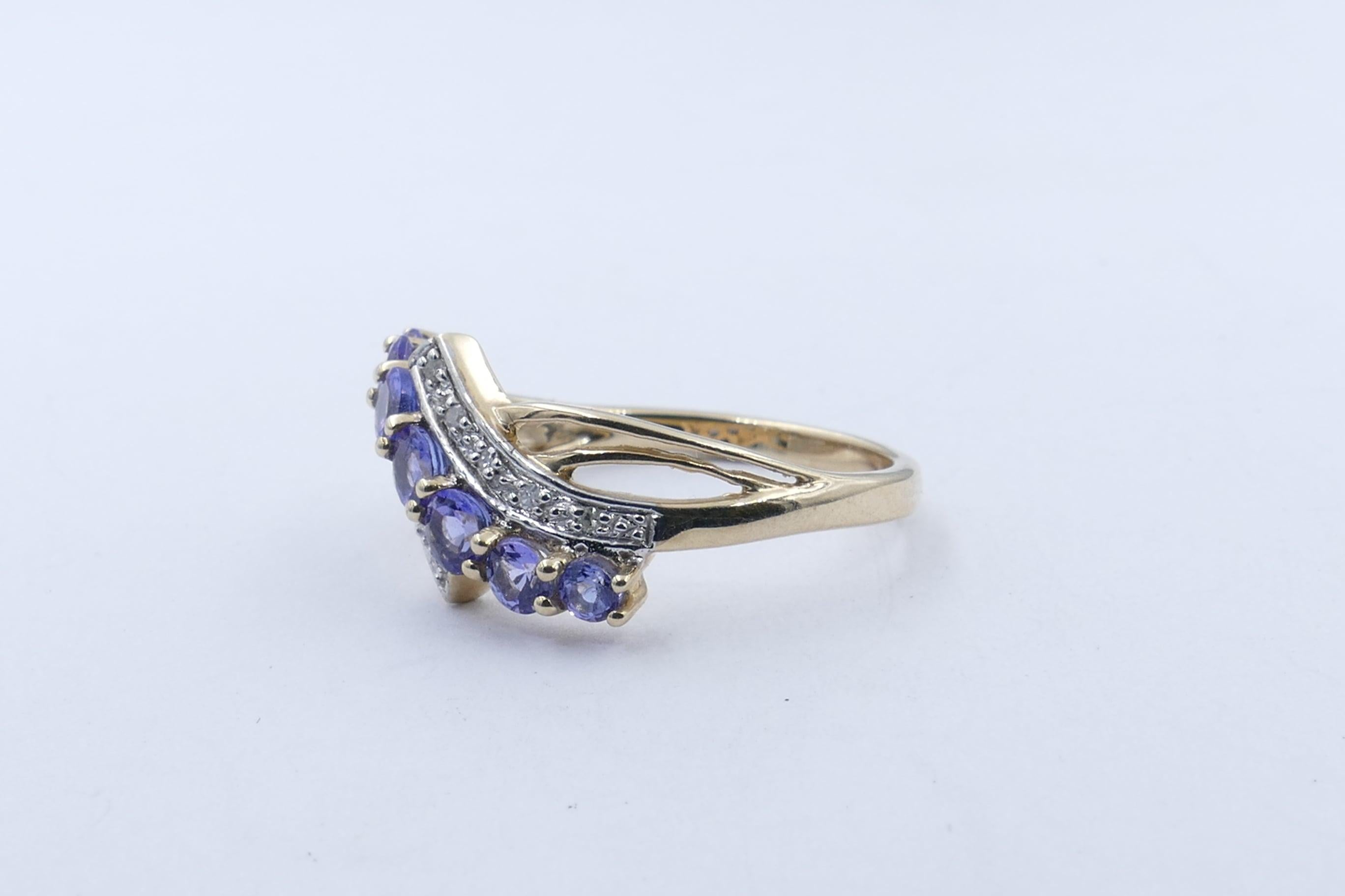 What a different Tanzanite Ring this one is! 
There are 7 Bluish-Purple stones medium colour set along a centre strip and are 