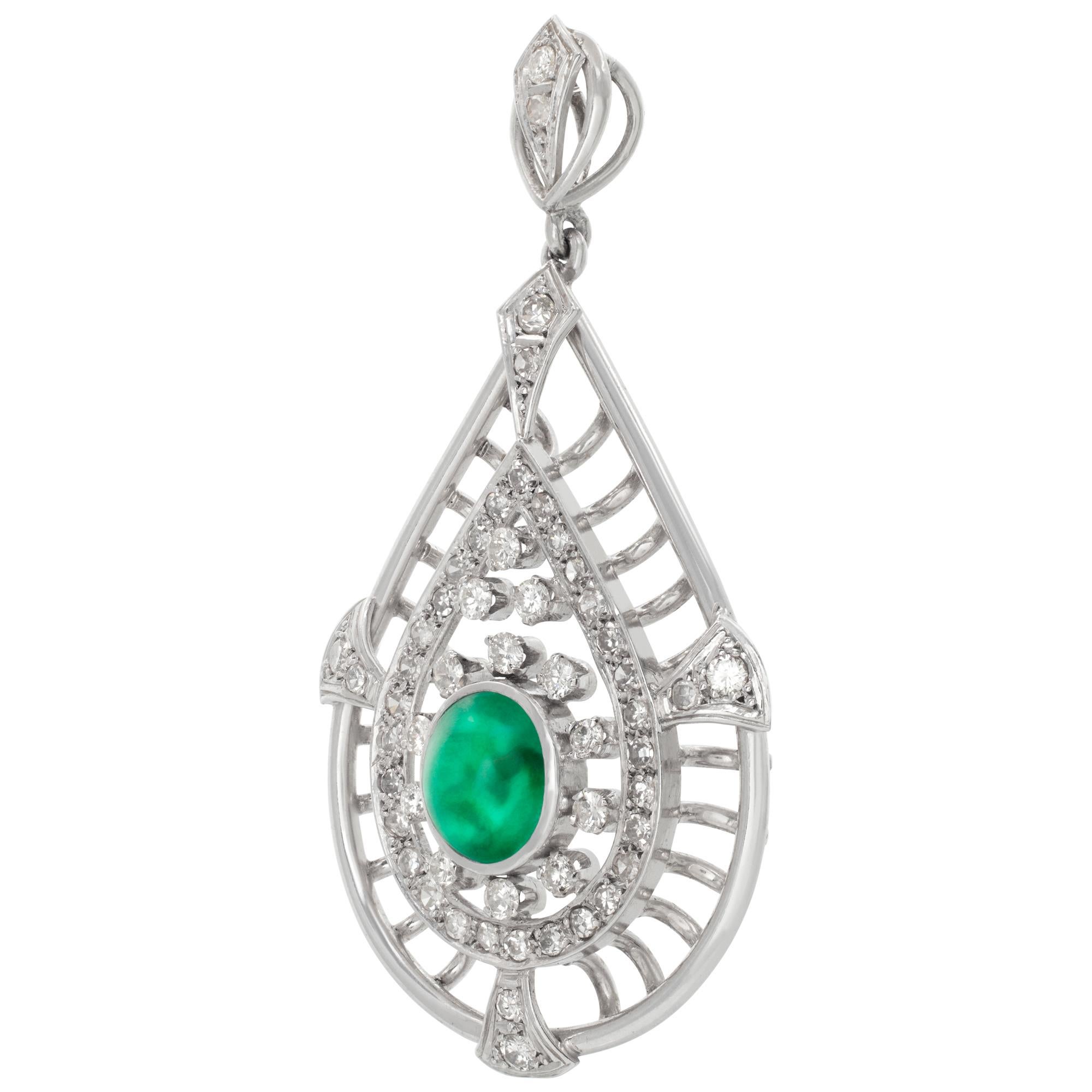18k white gold tear drop brooch with center 2.0 ct cabachon emerald and approx 2 cts in G-H color, VS-SI clarity  diamonds. Measures 2 inches. Width 1.25 inches.
