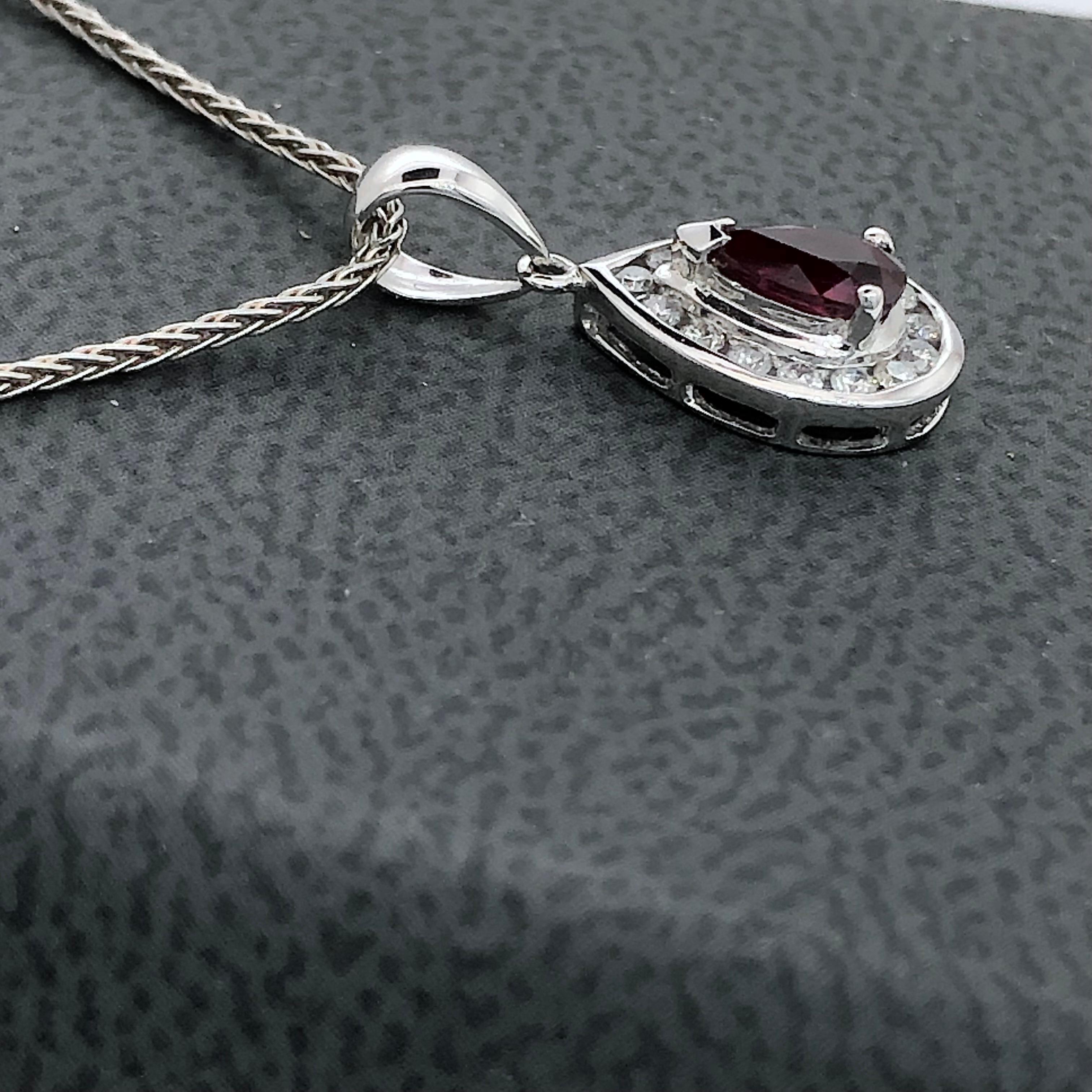 Modern White gold teardrop pendant set with pear shape natural ruby and  diamonds For Sale