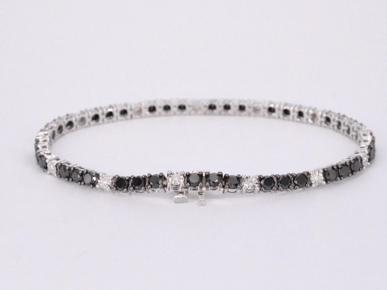 Contemporary White Gold Tennis Bracelet Set with Black and White Diamonds For Sale
