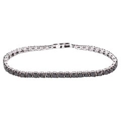 Bracelet tennis en or blanc serti de diamants noirs