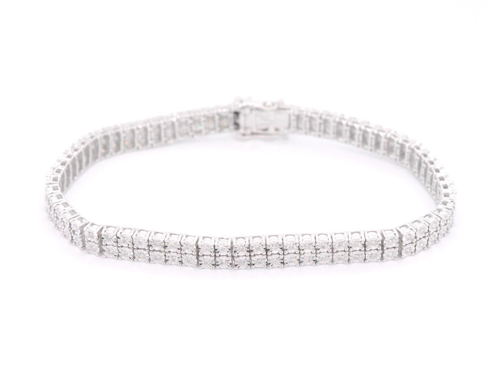 A white gold tennis bracelet with 2 rows of diamonds totaling 1.50 carats is a dazzling piece of jewelry that features rows of sparkling diamonds set in a band of lustrous white gold. The 1.50 carat weight of the diamonds makes this bracelet a truly
