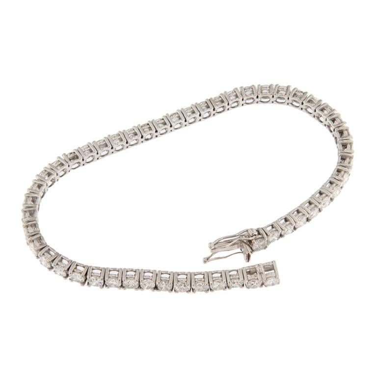 Contemporary White gold tennis bracelet with 6.95 ct brilliant cut diamonds For Sale