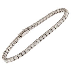 Bracelet de tennis en or blanc avec 6.95 ct de diamants taille brillant