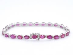 White gold tennis bracelet with diamonds and ruby