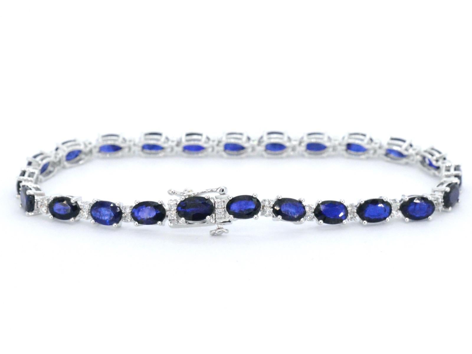 This exquisite bracelet features a combination of sparkling diamonds and a stunning sapphire, making it a perfect accessory for any occasion. 

The bracelet includes 0.50 carats of brilliant-cut diamonds, with a color grading of F-G and a clarity