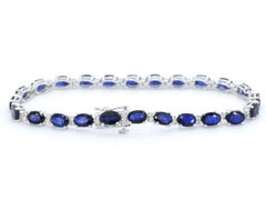 White gold tennis bracelet with diamonds and sapphire