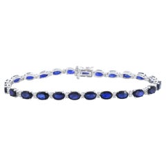 White gold tennis bracelet with diamonds and sapphire
