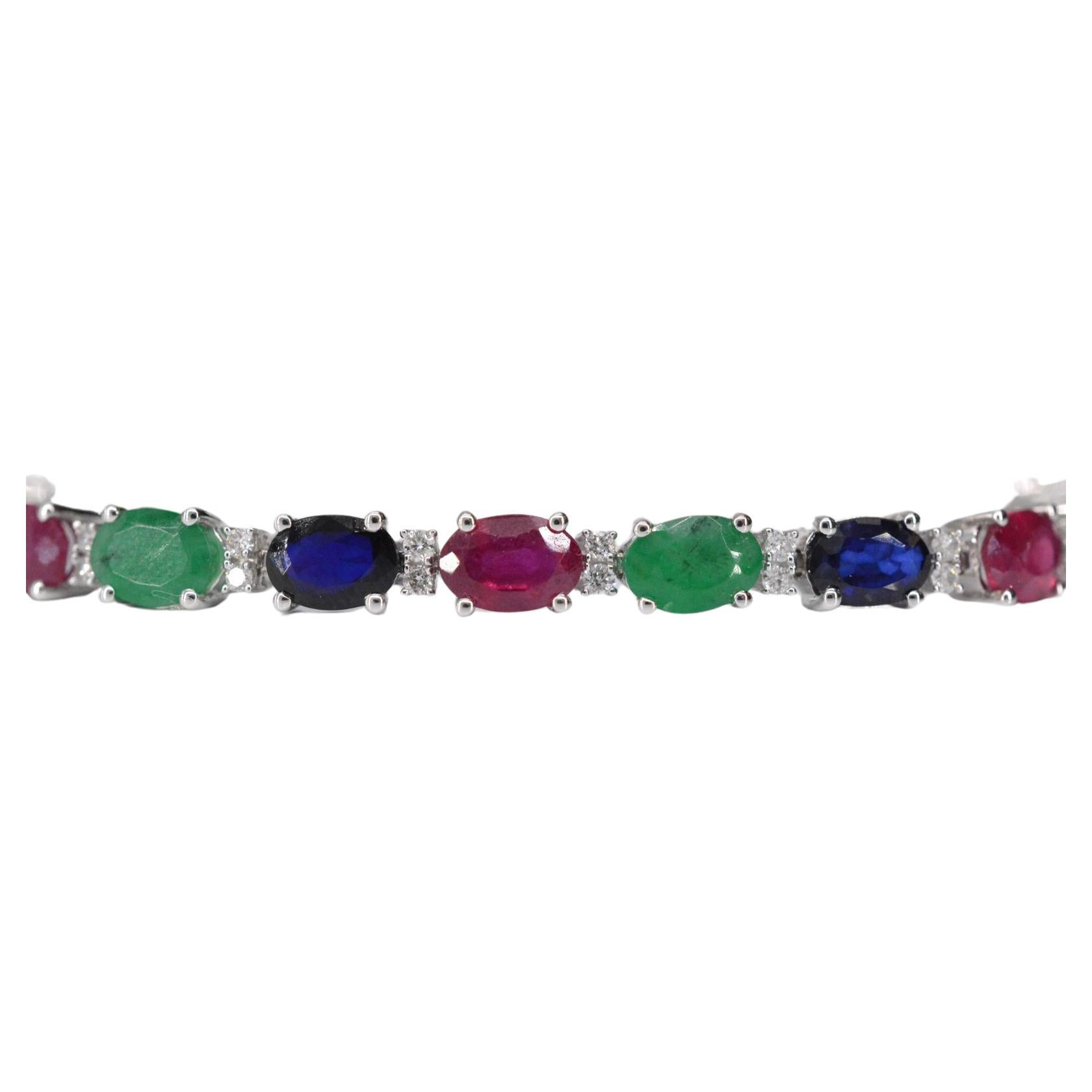 Introducing a remarkable bracelet that combines the sparkle of diamonds with the vivid hues of three exquisite gemstones. This elegant piece features 0.50 carats of brilliant-cut diamonds with a color grading of F-G, a clarity range of SI-P, and