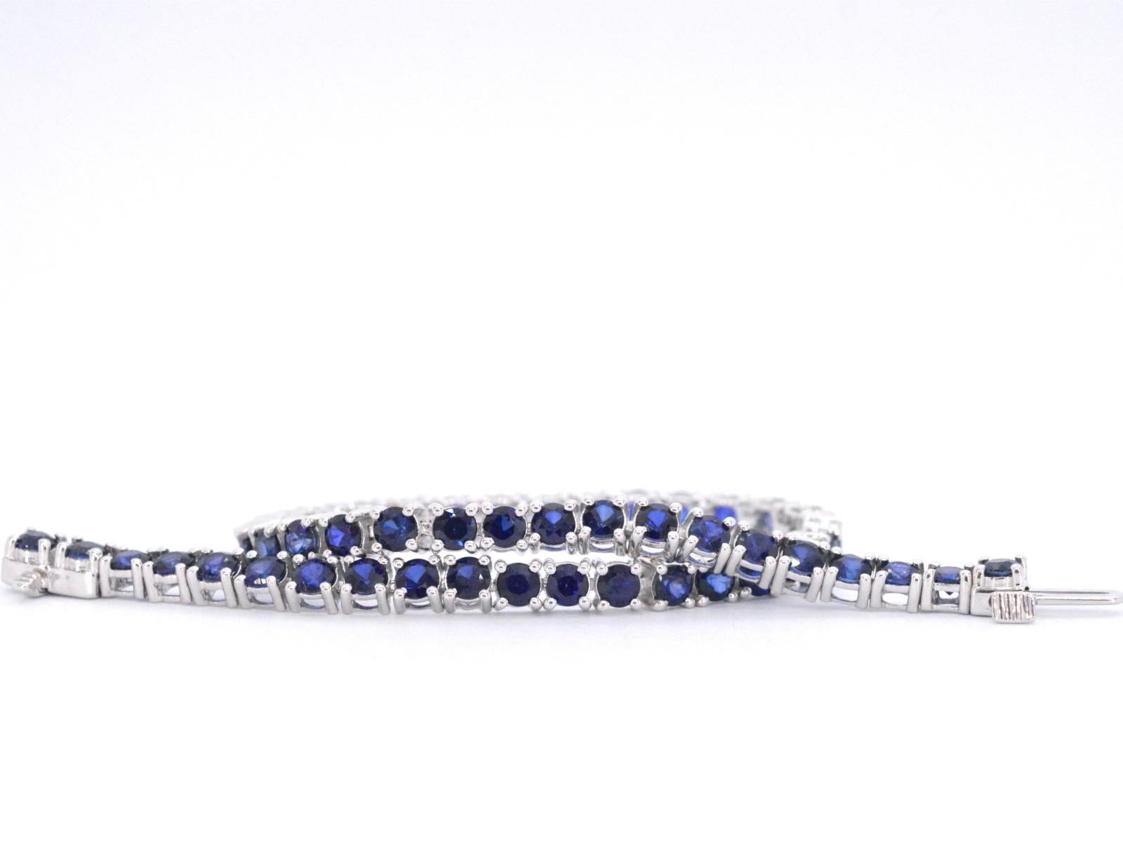 This white gold tennis bracelet is a true showstopper that is adorned with brilliant-cut sapphires. The sapphires are expertly set in a classic tennis style, creating a beautiful and timeless look. Each sapphire sparkles with unparalleled