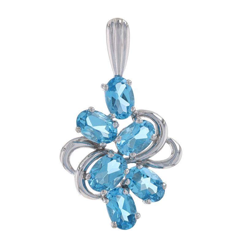 Metal Content: 10k White Gold

Stone Information
Natural Topaz
Treatment: Routinely Enhanced
Carat(s): 3.45ctw
Cut: Oval
Color: Blue

Total Carats: 3.45ctw

Style: Cluster
Theme: Floral

Measurements
Tall (from stationary bail): 1 3/16
