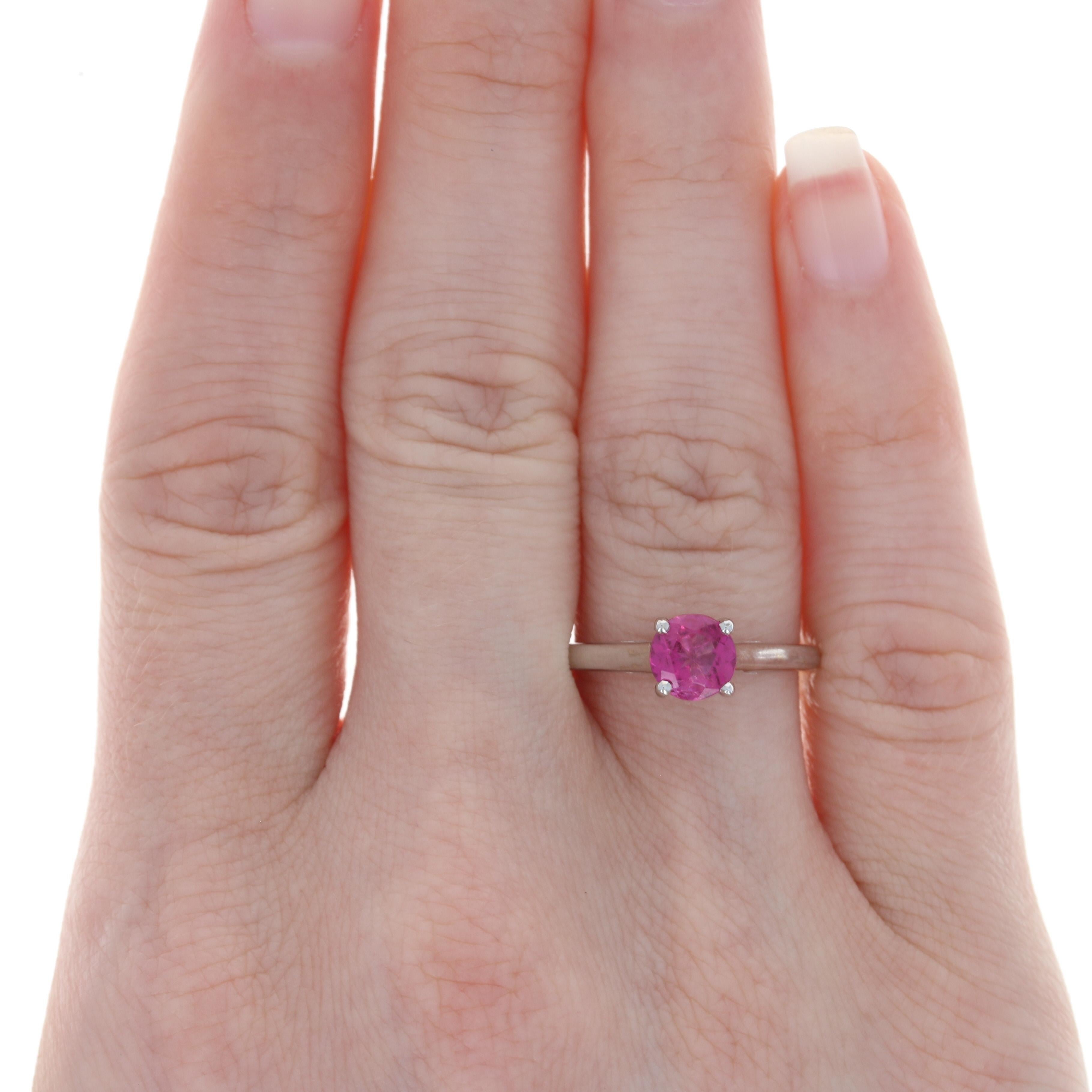 Size: 7
 Sizing Fee: Up or Down 2 sizes for $25
 
 Metal Content: 14k White Gold
 
 Stone Information: 
 Genuine Tourmaline
 Carat: .82ct (weighed)
 Cut: Round
 Color: Pink
 Diameter: 6.2mm 
 
 Style: Solitaire
 Features: Cathedral Mount
 
 Face