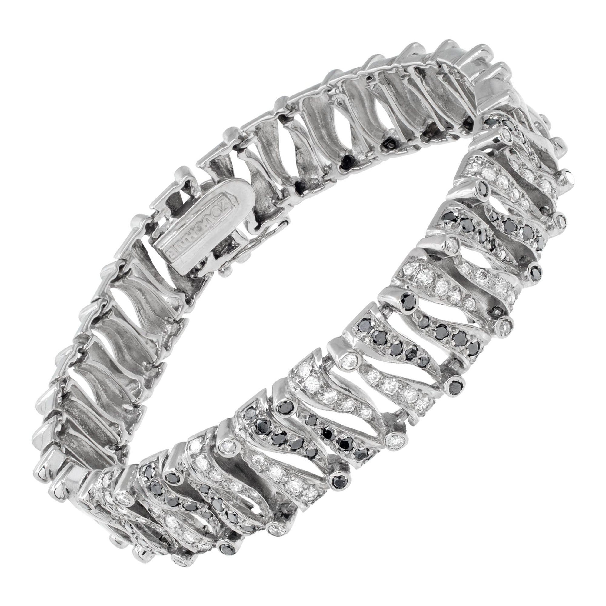 Pulsera de oro blanco con diamantes blancos y negros
