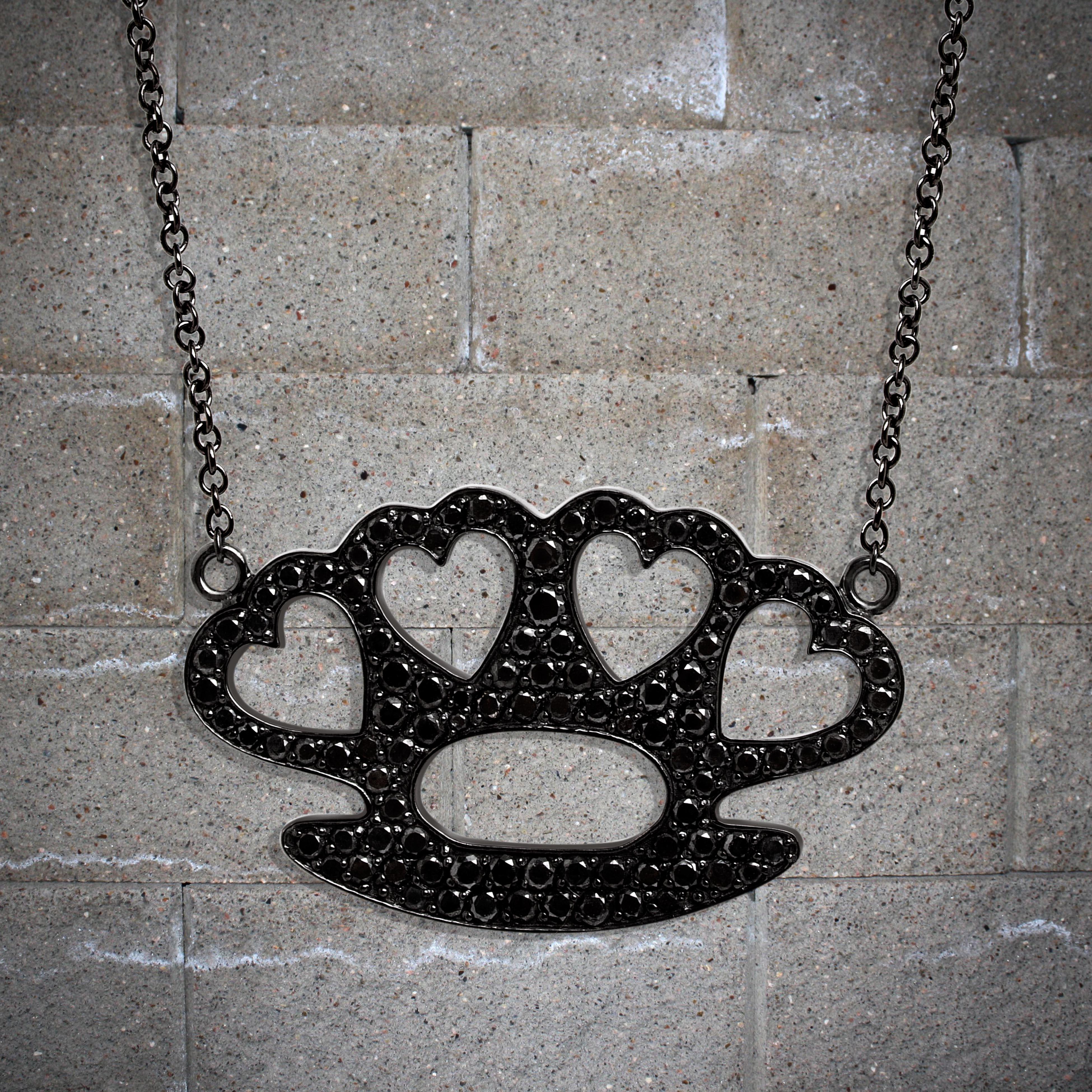 The Brass Heart Knuckles Pendant
White Diamonds set on White Gold.
Crafted to order. Please allow up to 3 weeks for delivery.