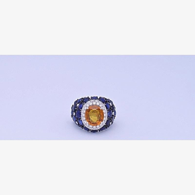 18 kt. white gold ring with 0.97 carat of round-cut diamonds, 9.12 carat of rose-cut blue sapphires and 4,54 carat of oval-cut yellow sapphires.
This ring is completely hand-made in Italy and is one of a kind piece.
The ring has a reducer inside to