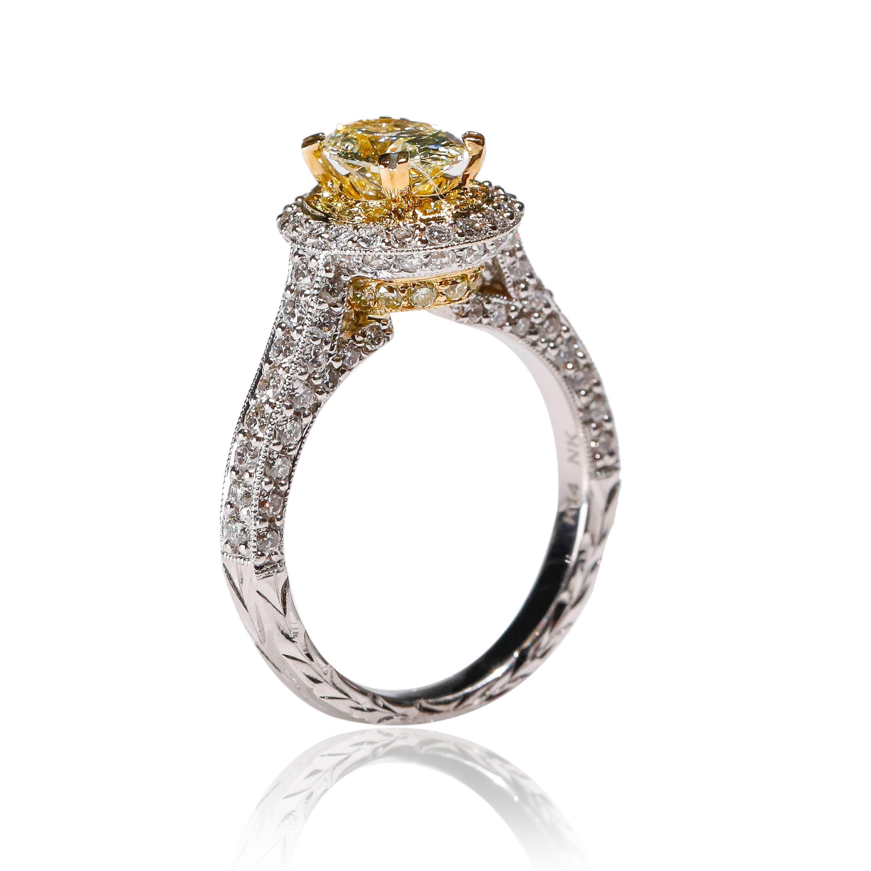 14 Karat White Gold Yellow Diamond Halo Engagement Ring Designed by Natalie K

Crafted in 14 kt White Gold, this Unique design showcases a Yellow Diamond 1.03 TCW oval-shaped diamond, set in a halo of oval mesmerizing diamonds, Polished to a