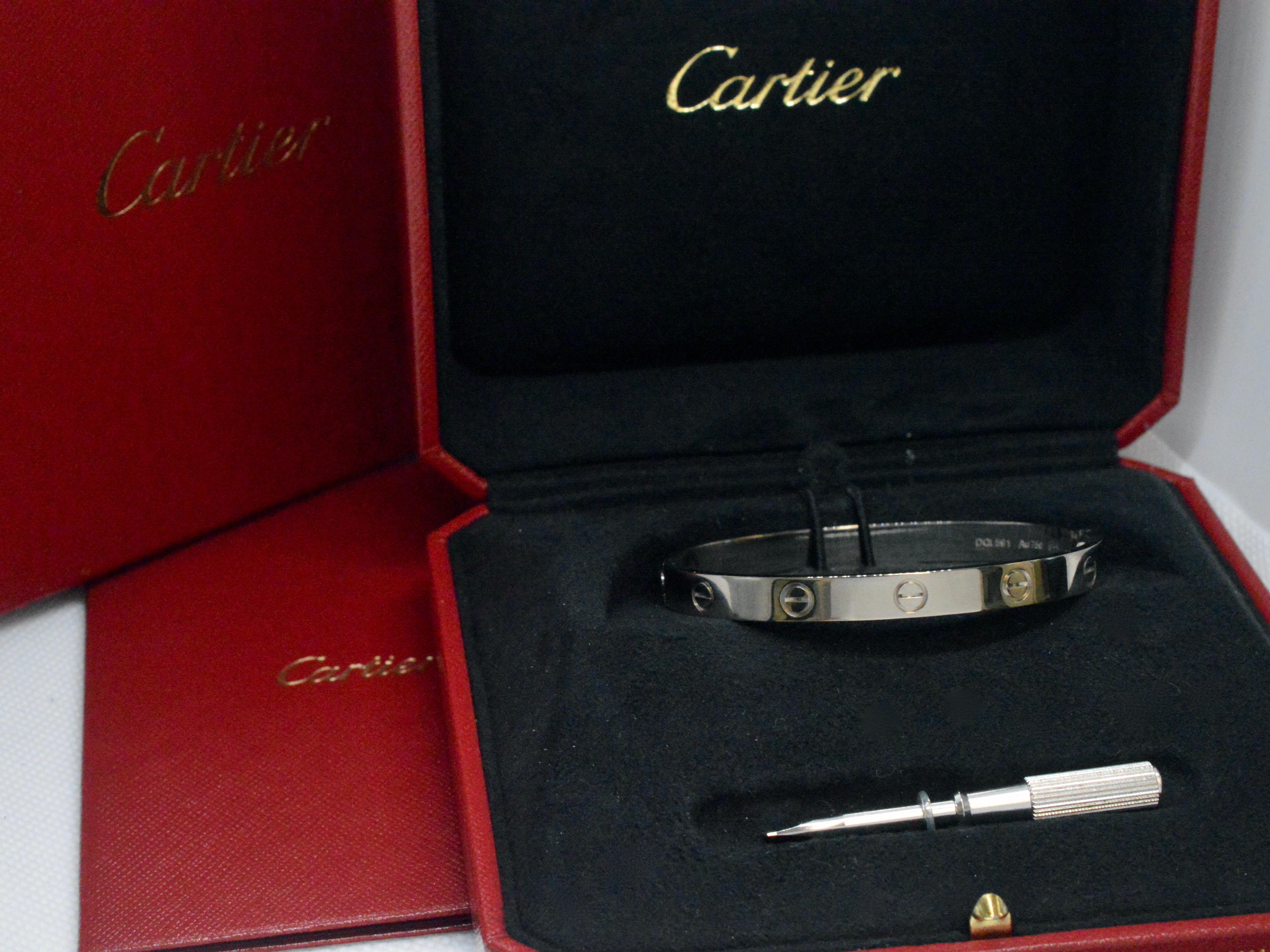 Elegant and timeless, the Cartier LOVE bracelet is a symbol of enduring commitment and sophistication. Crafted from lustrous 18K gold, this exquisite piece weighs 32.1 grams, adding a luxurious touch to any ensemble. The bracelet, with a size of 17,