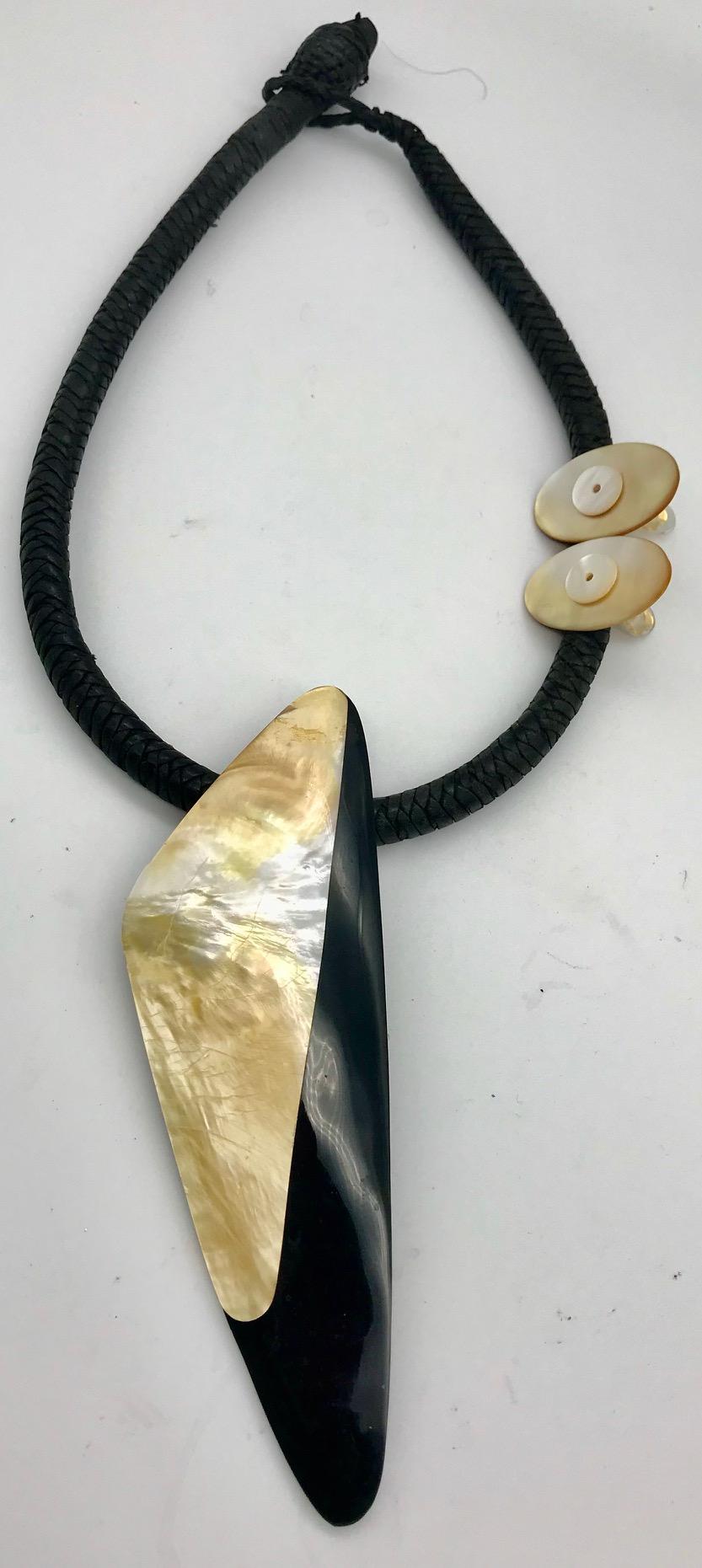 White /gold nacre with black Lucite Pendant on the woven leather necklace. This architectural style Pendant could be also worn on mainly  black side . It has French Deco up-cycled earrings to match.
The Pinctada Maxima  with white /golden nacre is