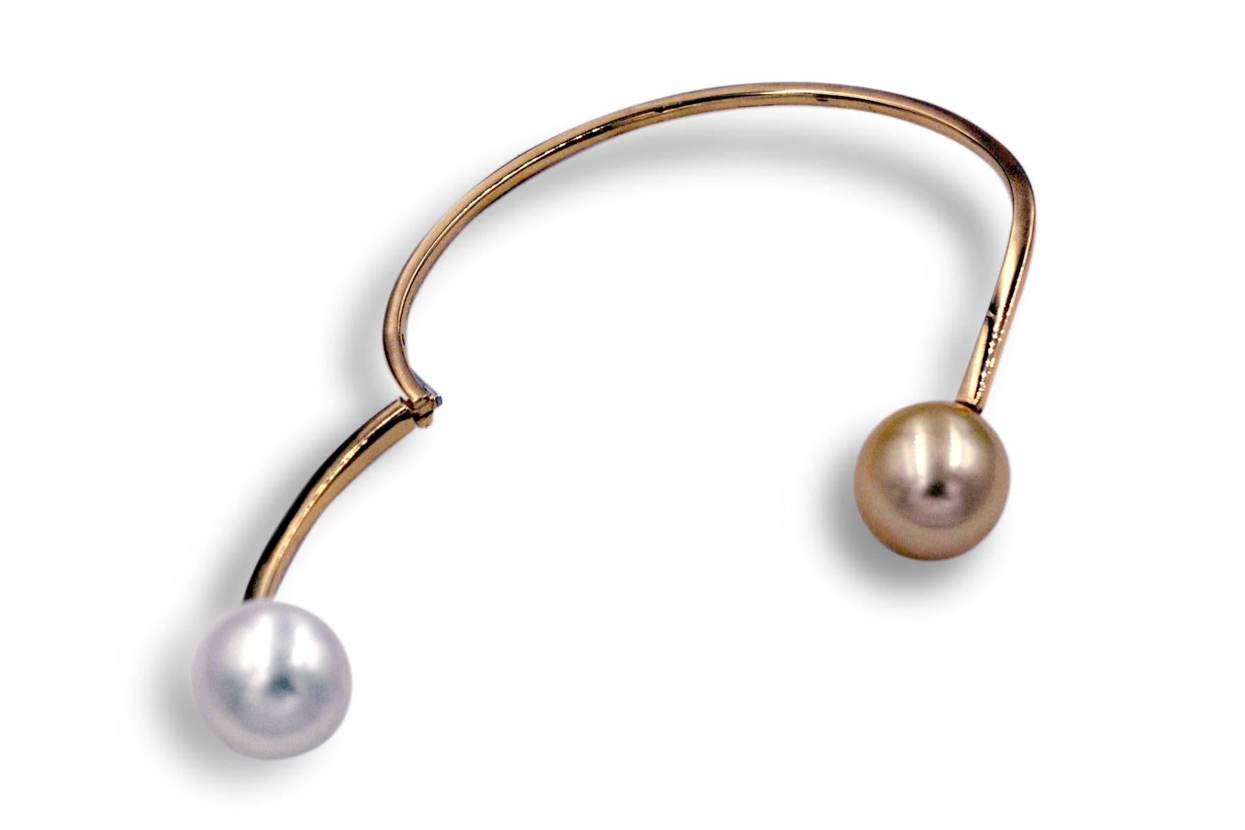18K Yellow gold bangle featuring one white South Sea & one golden South Sea Pearl measuring 13-14 mm. Pearls can be changed to Tahitian, Pink upon request. Price subjected to change. 

Attached are prices of different styles. 

