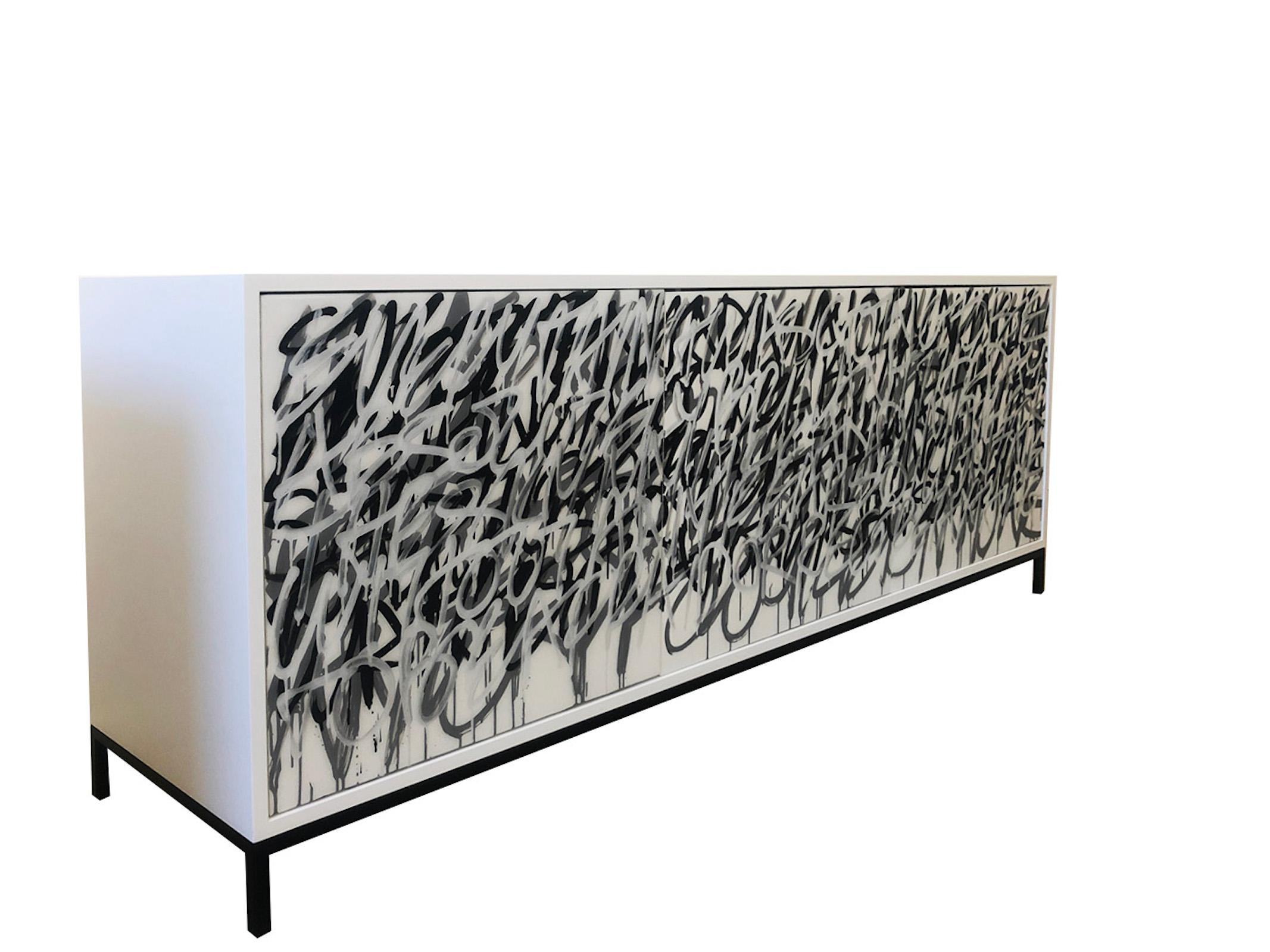Our White Graffiti Cabinet is designed, and hand finished in our Toronto studio, Morgan Clayhall.

This design is based on our classic Say It Again graffiti cabinet.  We have interpret it into a light version with more white in the artwork.

The