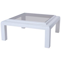 Table basse en toile de gazon blanche avec verre fumé