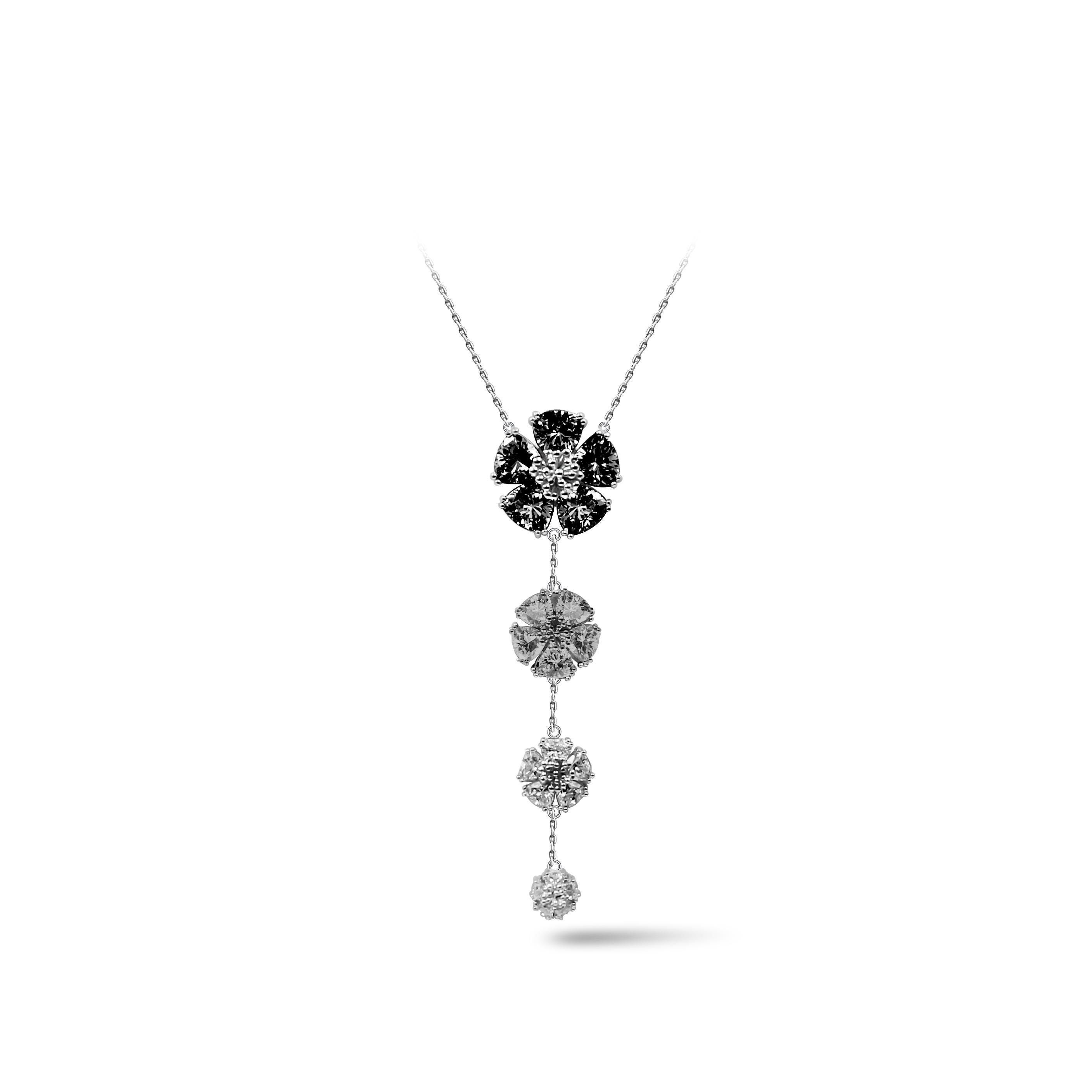 Designed in NYC

.925 Sterling Silver multiple White Topaz, Gray and Black Spinel Graduated Blossom Stone Lariat Necklace. No matter the season, allow natural beauty to surround you wherever you go. Graduated blossom stone lariat necklace: