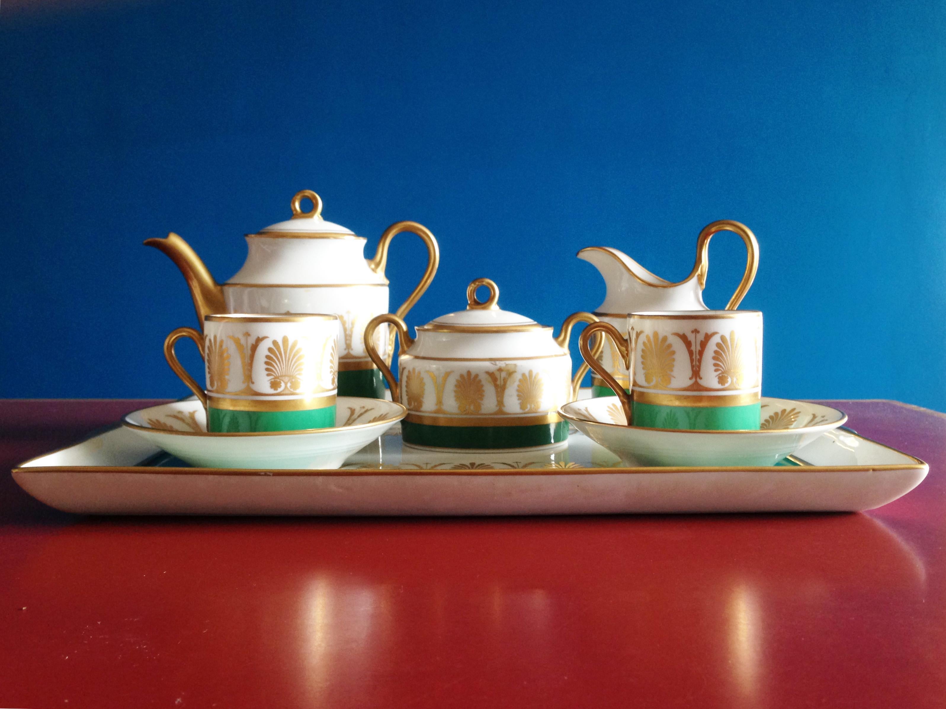 White, green & golden ceramic 1960s coffee service attributed to Gio Ponti for Richard Ginori, Pittoria di Doccia. This service was probably produced in Italy in '60s with a neo-Classic decoration in green and gold colors.
One cup shows a visible