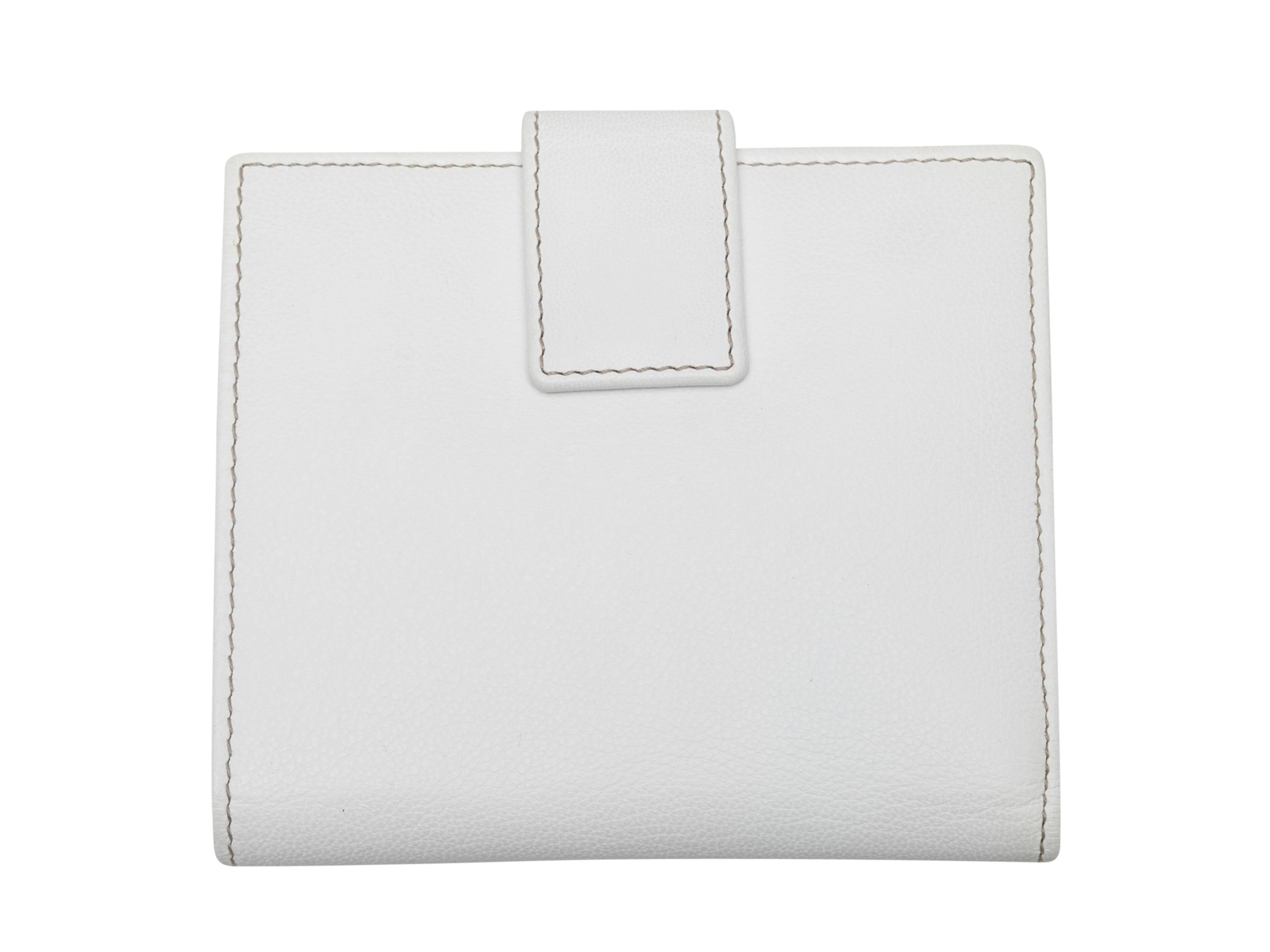 White leather wallet by Gucci. Silver-tone hardware. Web trim at front. 4.5