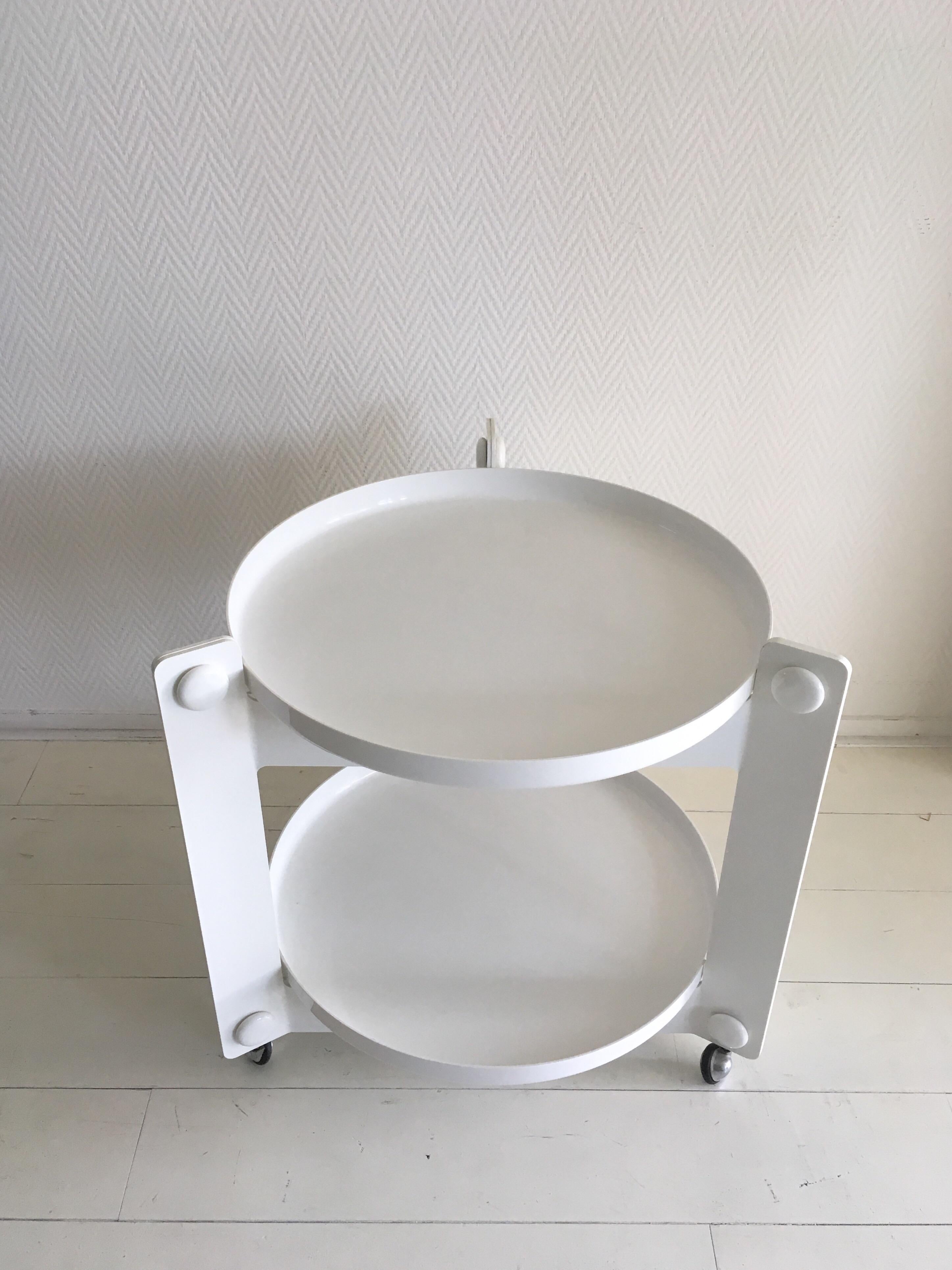 This Spage Age tray table was designed by Luigi Massoni for Guzzini, circa 1970s. It features two removable trays and remains in good condition with normal wear consisting it's age.