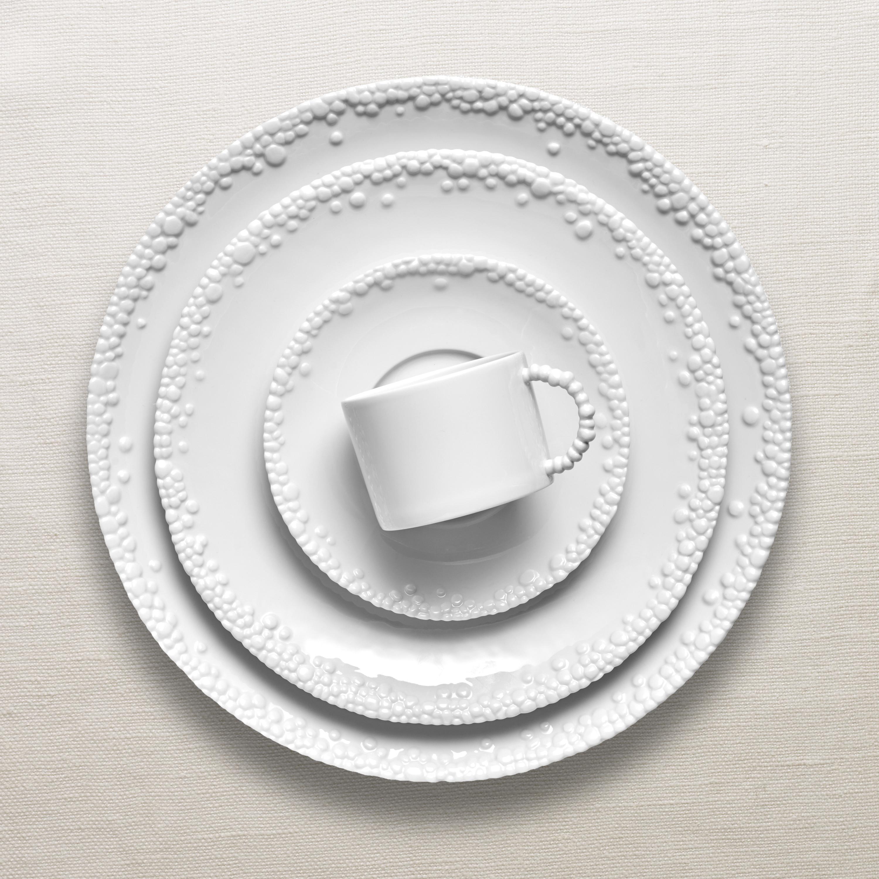 Fine Porcelain dinnerware featuring an intricate and organic pattern reminiscent of desert pebbles and of the endless stars in the desert sky.

The Haas Mojave Dinnerware Set Includes:

Haas Mojave Charger (12.5in.)
Haas Mojave Dinner Plate