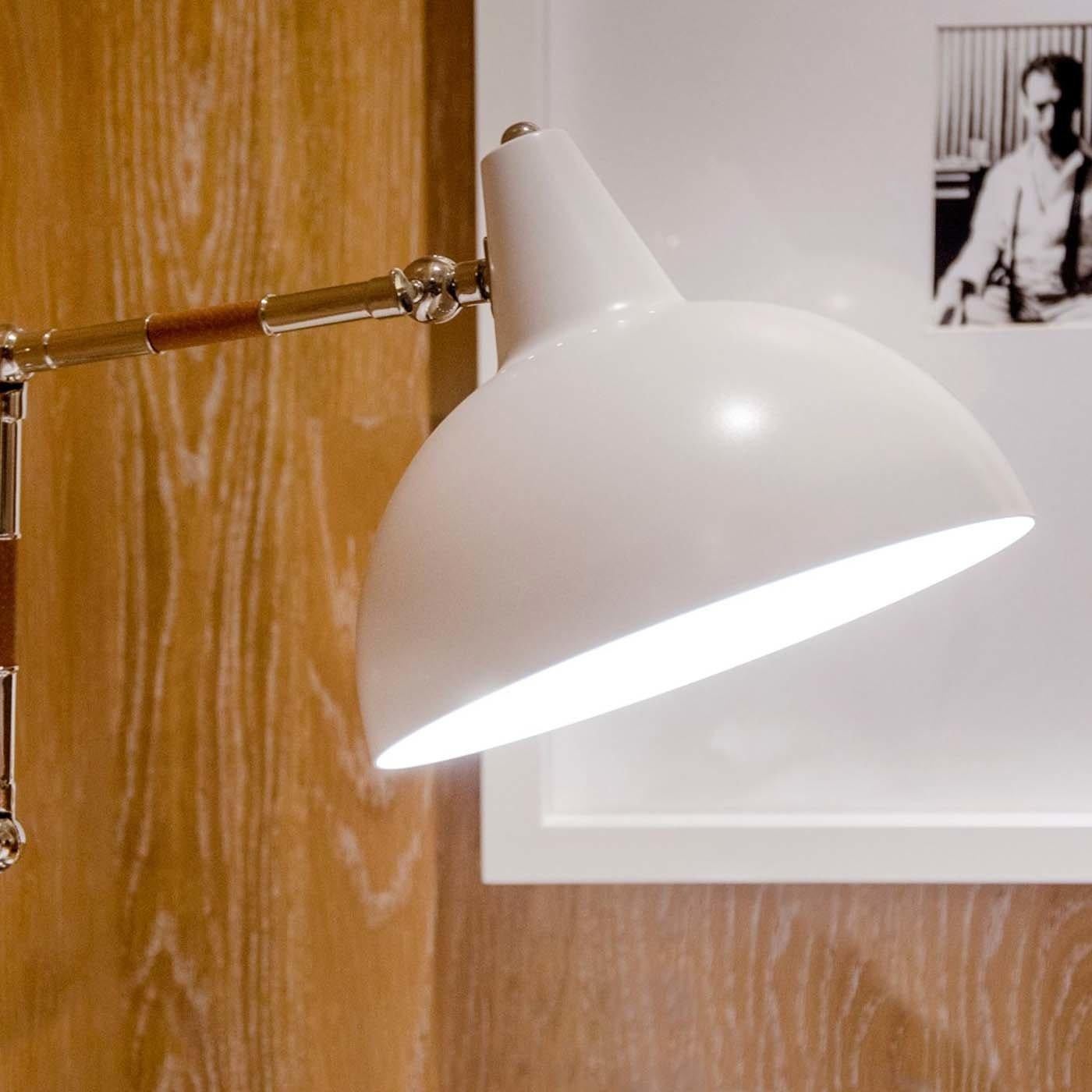 A revisitation of retro desk lamps, the Lamal Wall Light radiates timeless style. With three different hinges, the light with a painted metal shade is easy to position over a work space or next to a bed as a reading lamp. The arm is accented with