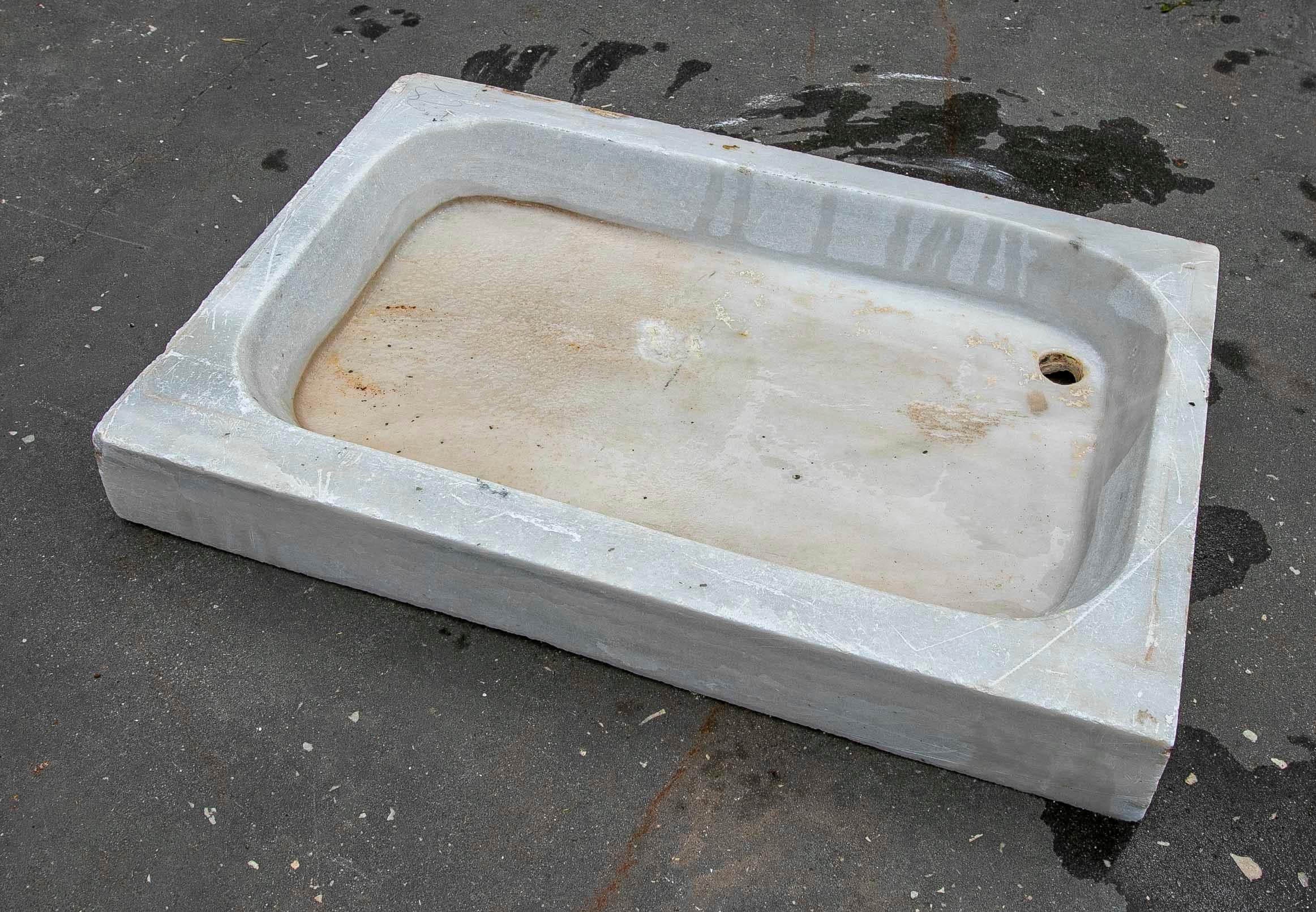 White hand carved Marble Washbasin with One Sink in a Single Block.