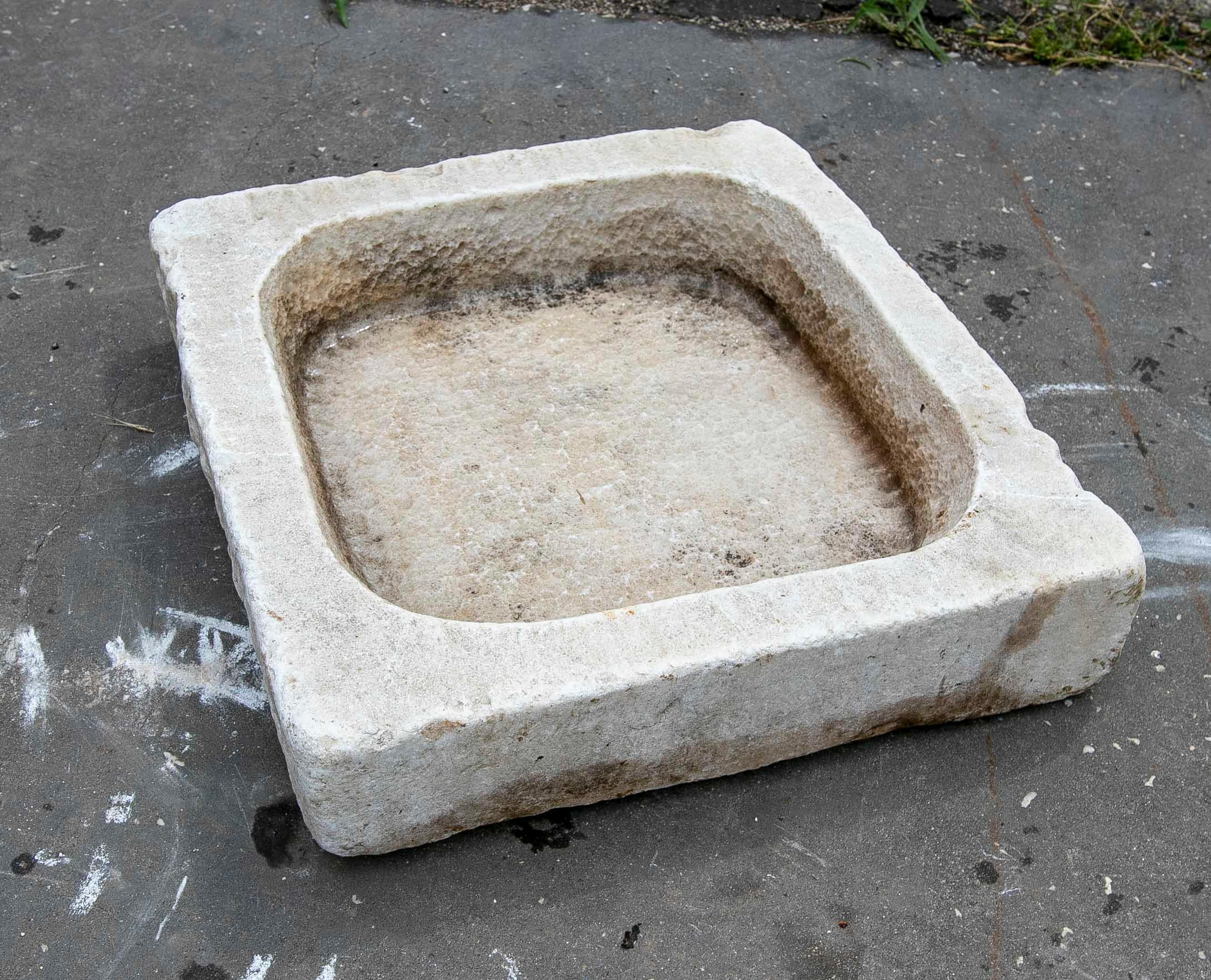 White hand carved Marble Washbasin with One Sink in a Single Block.