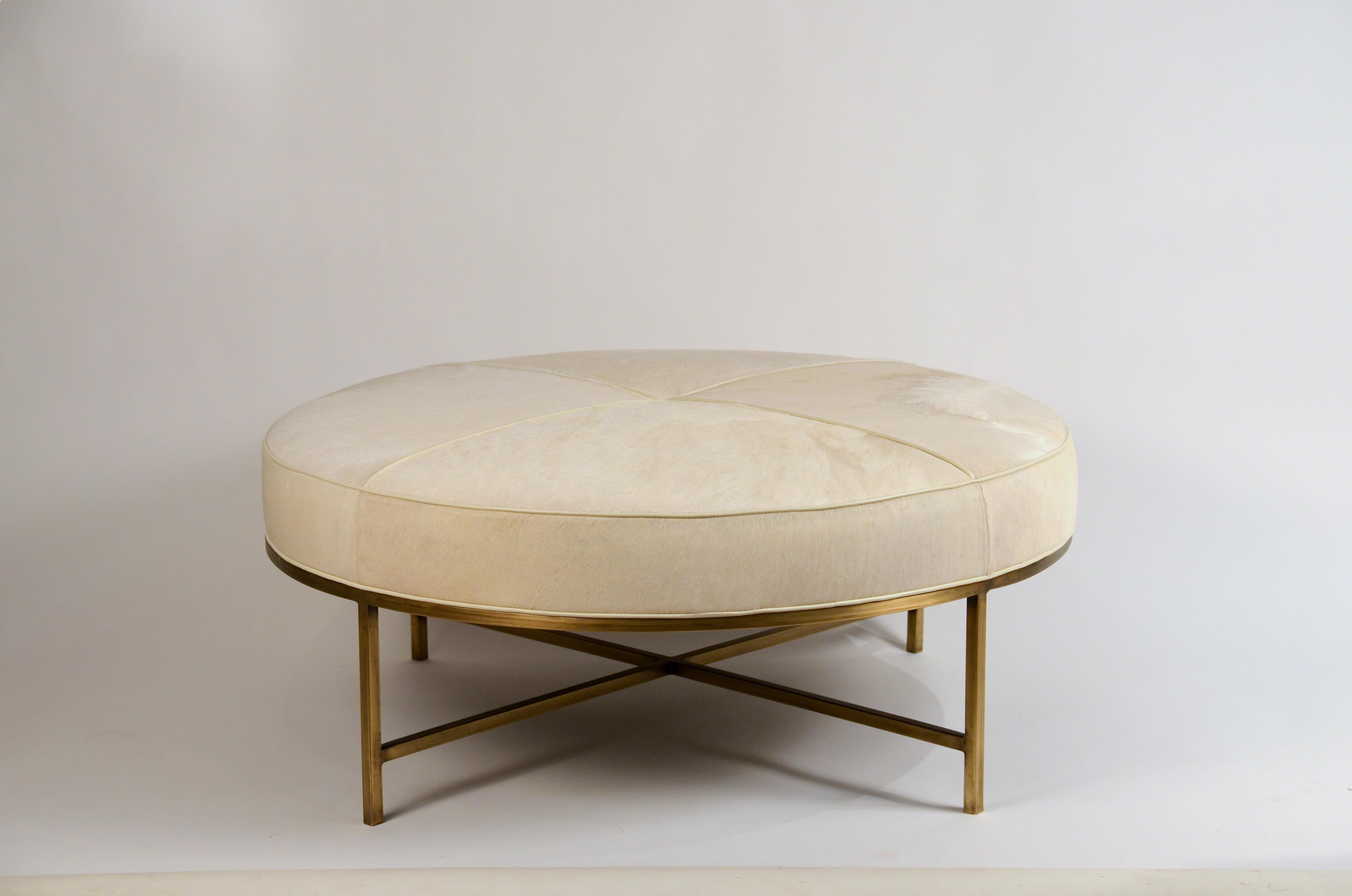 White hide and patinated brass 'Tambour' ottoman by Design Frères.

The last picture is of a different version of the ottoman in the same size.

Perfect as a coffee table, with trays.