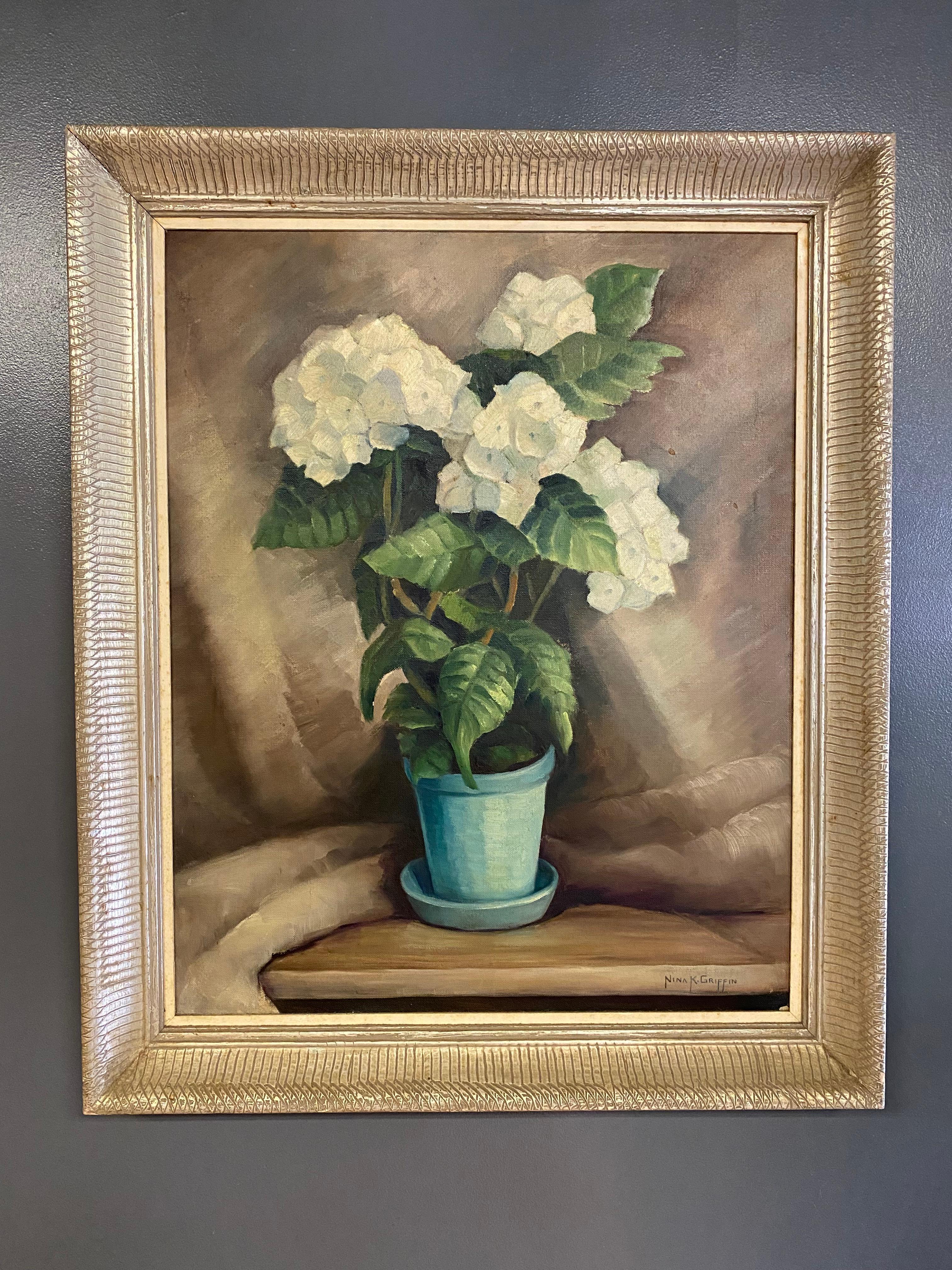 Painted by Nina Kickbush Griffin (1884-1968). Signed lower Right, Nina, K Griffin. Titled on the reverse, White Hydrangea. Painted circa 1940-50. This particular style was indicative of the times. She has depicted a single potted White Hydrangea