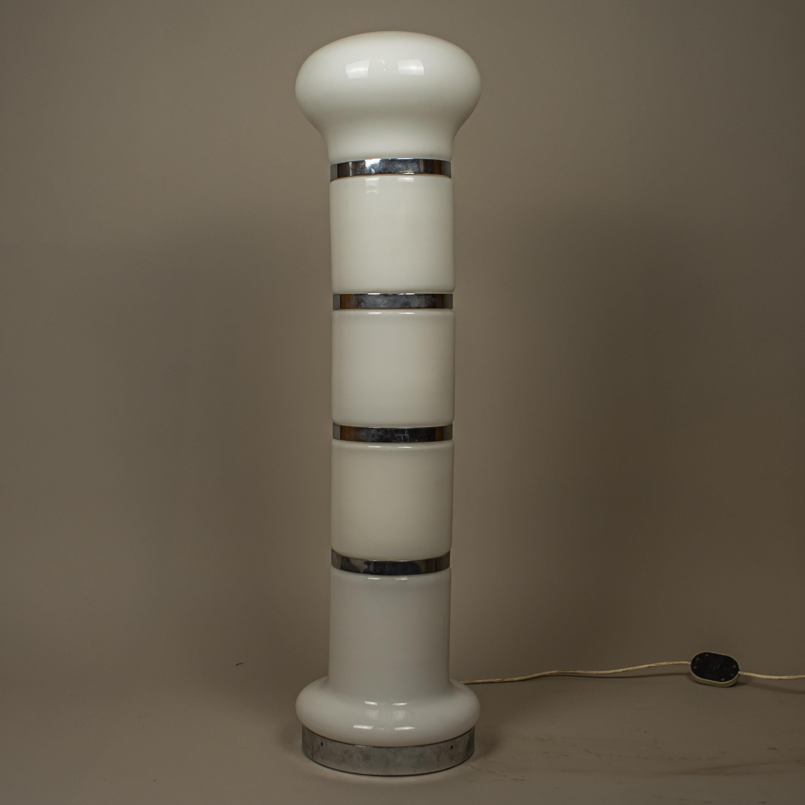 A large white Murano glass floor lamp in the style of Carlo Nason. The column-shaped design is made of 5 glass parts over a chrome metal structure. It uses 4 bulbs.