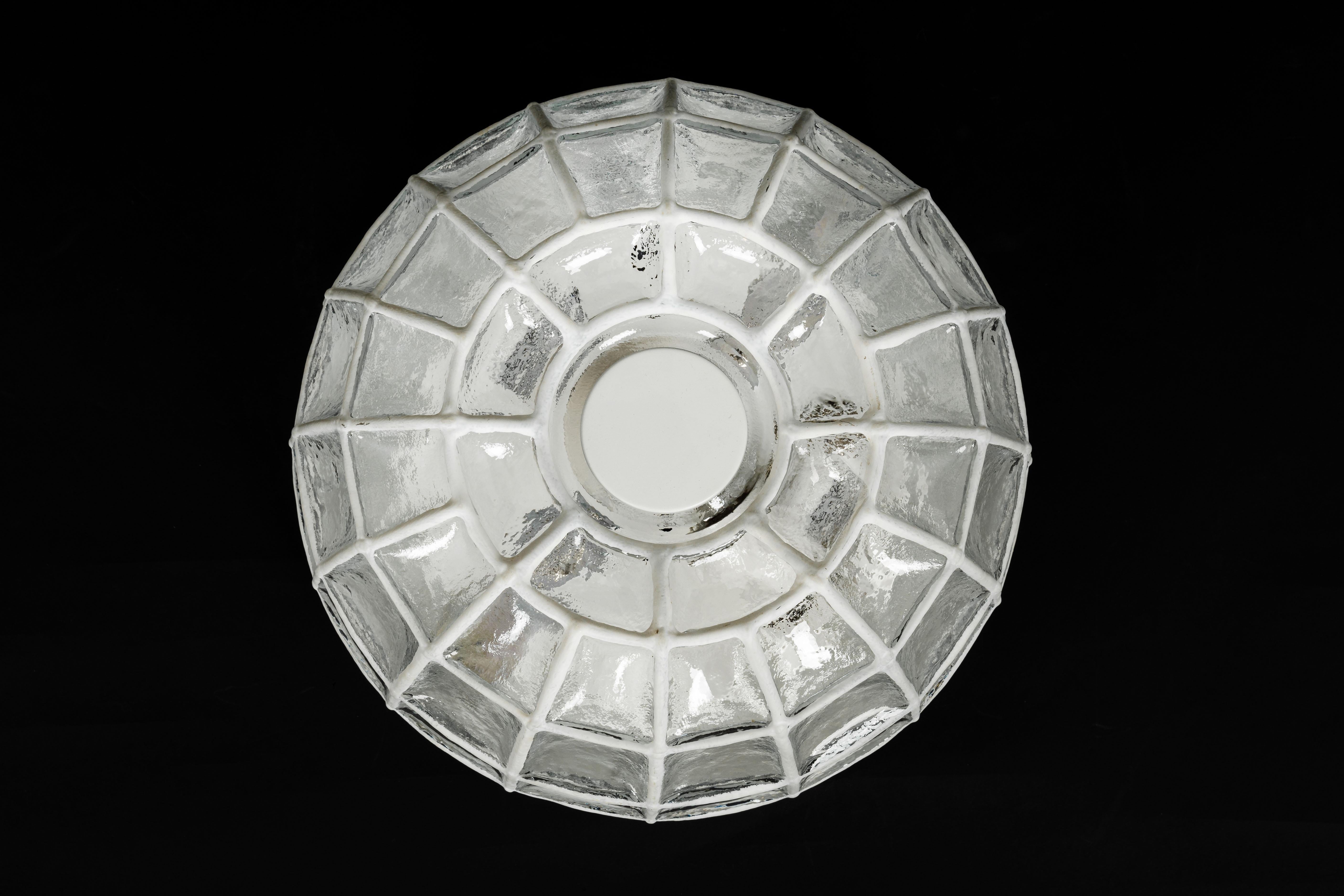 Minimalist white iron and clear glass ceiling or wall light manufactured by Limburg Glashu¨tte, Germany, circa 1960-1969.

Heavy quality and in very good condition. Cleaned, well-wired and ready to use. The fixture requires 1 x E27 standard bulbs